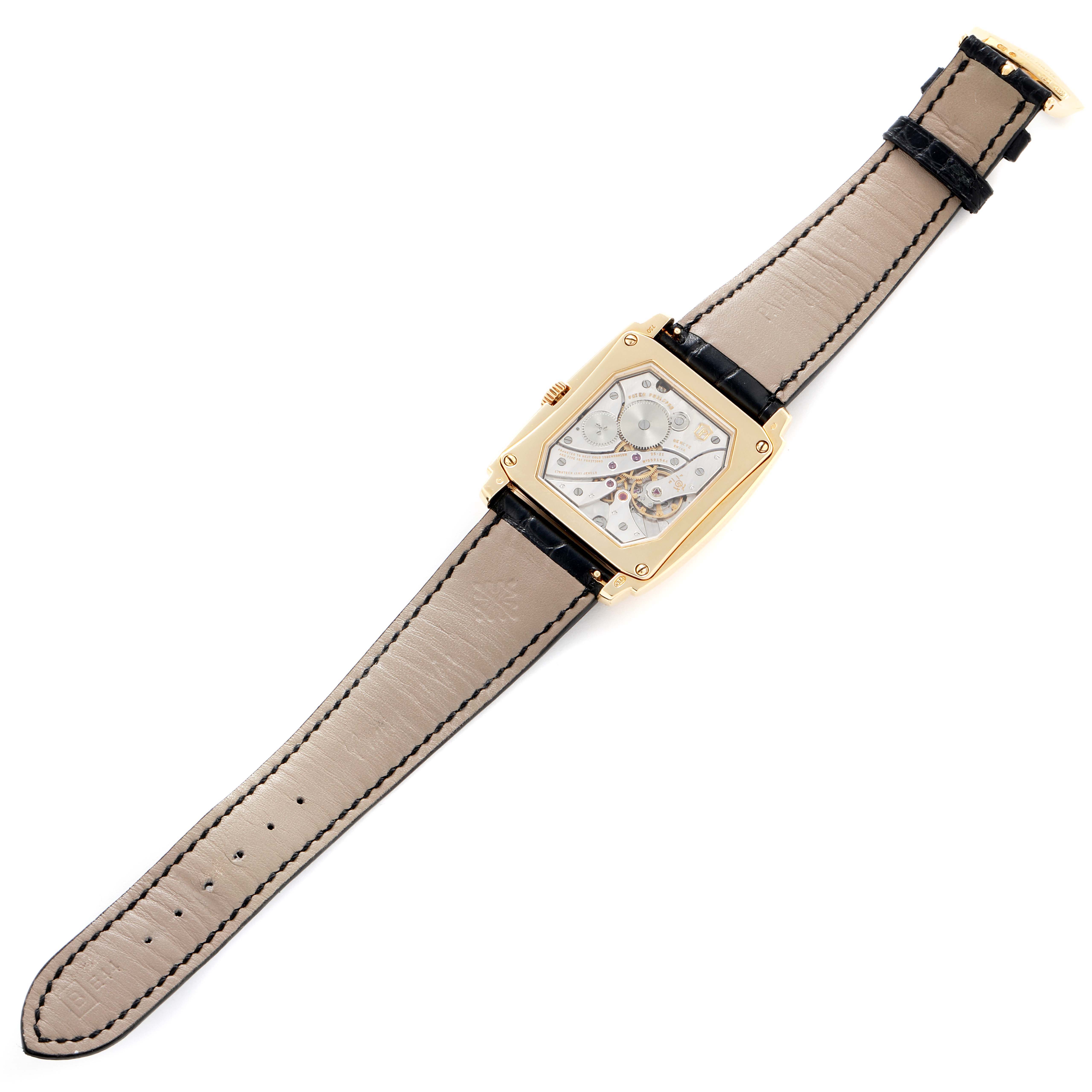 The Patek Philippe Gondolo 5124 Men
s Yellow Gold Silver Dial watch is shown from a top-down angle, displaying its face, case, and strap fully extended.