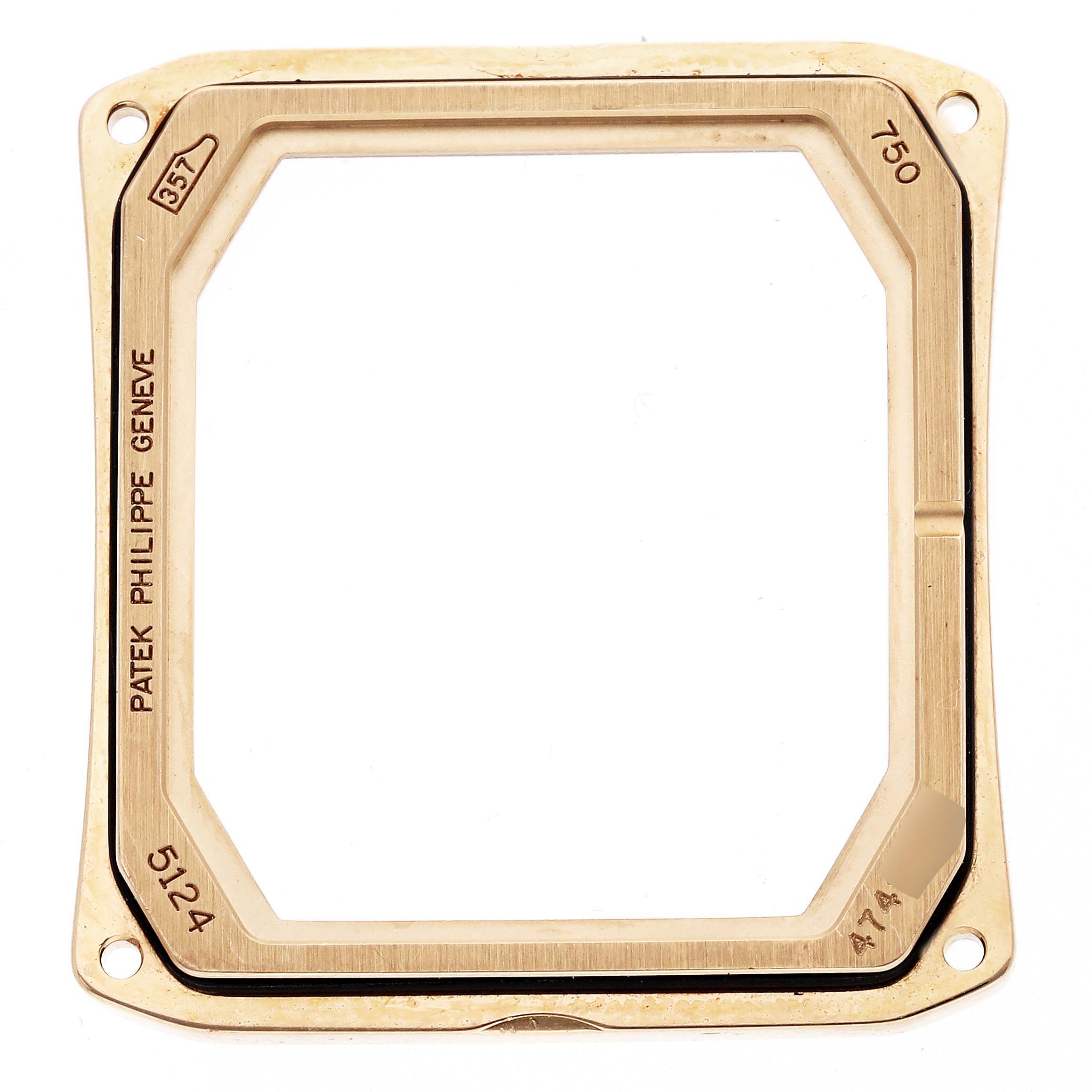 The image shows the bezel of a Patek Philippe Gondolo 5124 Men
s Yellow Gold Silver Dial watch, viewed from above, highlighting its gold finish and engravings.