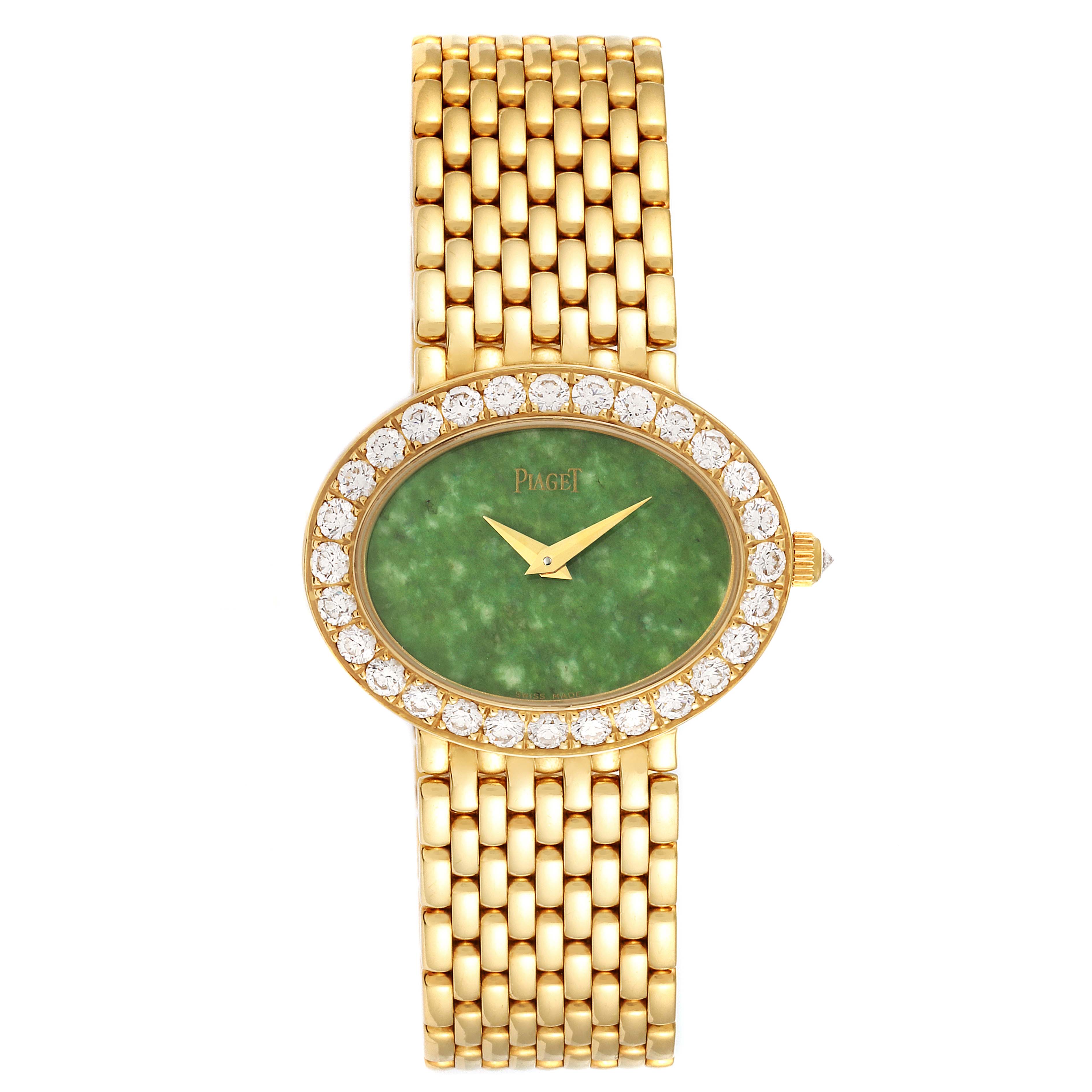The Piaget P10242 Women's Yellow Gold Green Dial P10242 Women's Yellow Gold Green Dial P10242 model watch is shown from a top-down angle, displaying its jadeite dial, diamond bezel, and gold bracelet.