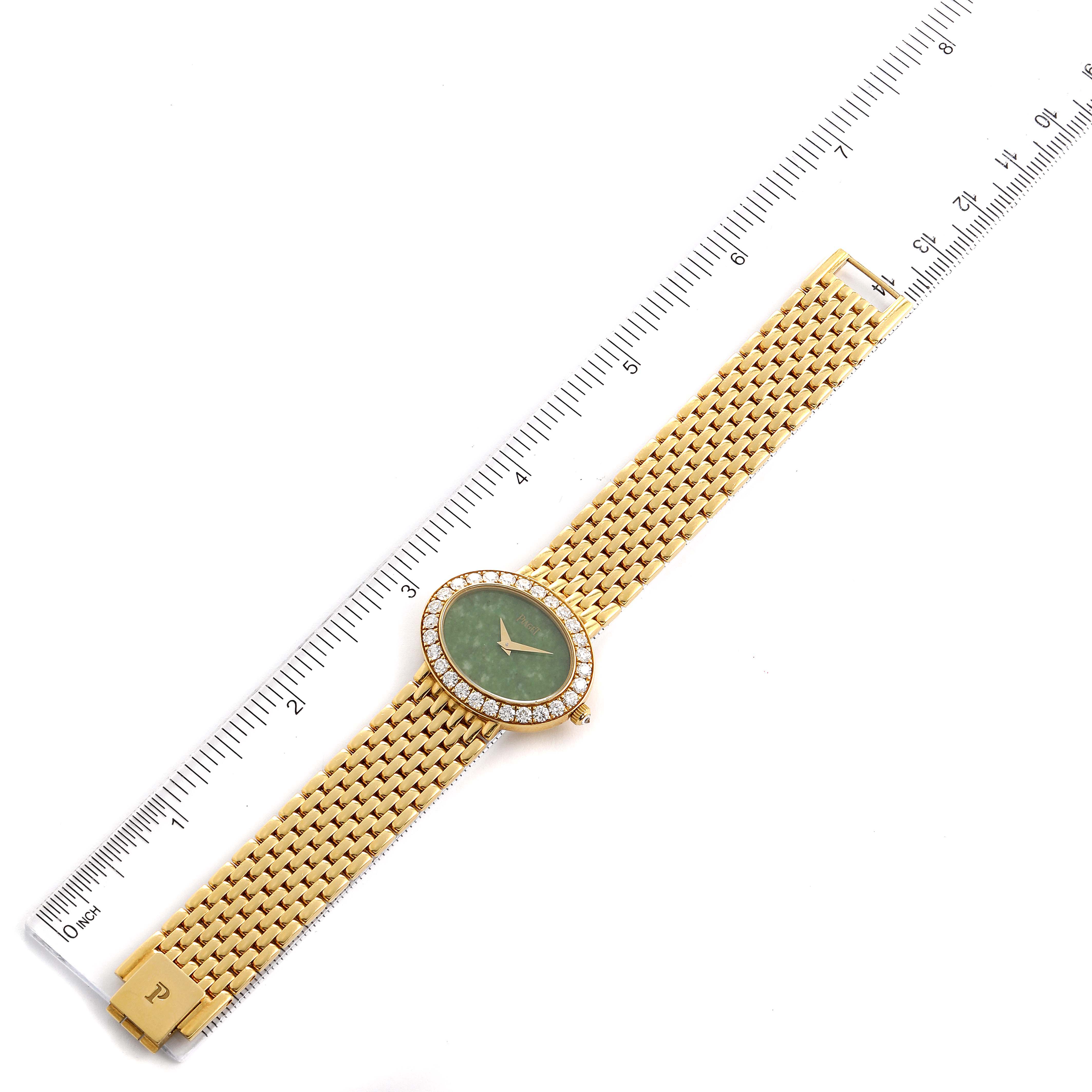 The Piaget P10242 Women's Yellow Gold Green Dial P10242 Women's Yellow Gold Green Dial P10242 model is shown from an overhead angle, displaying its yellow gold band, jadeite dial, and diamond-encrusted bezel.