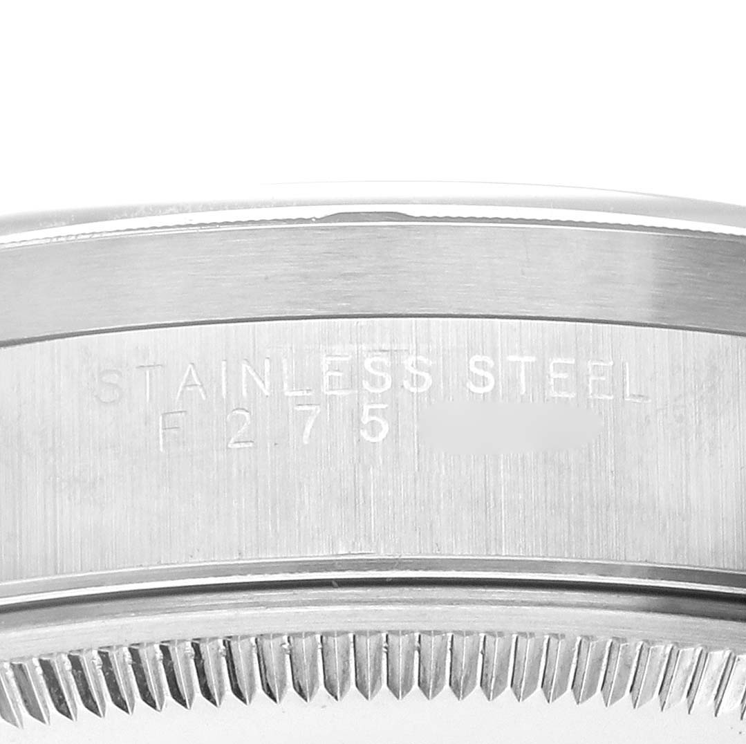 The image shows a close-up of the stainless steel back case of the Rolex Air-King 14010M Men's Stainless Steel Black Dial 14010M Men's Stainless Steel Black Dial watch.
