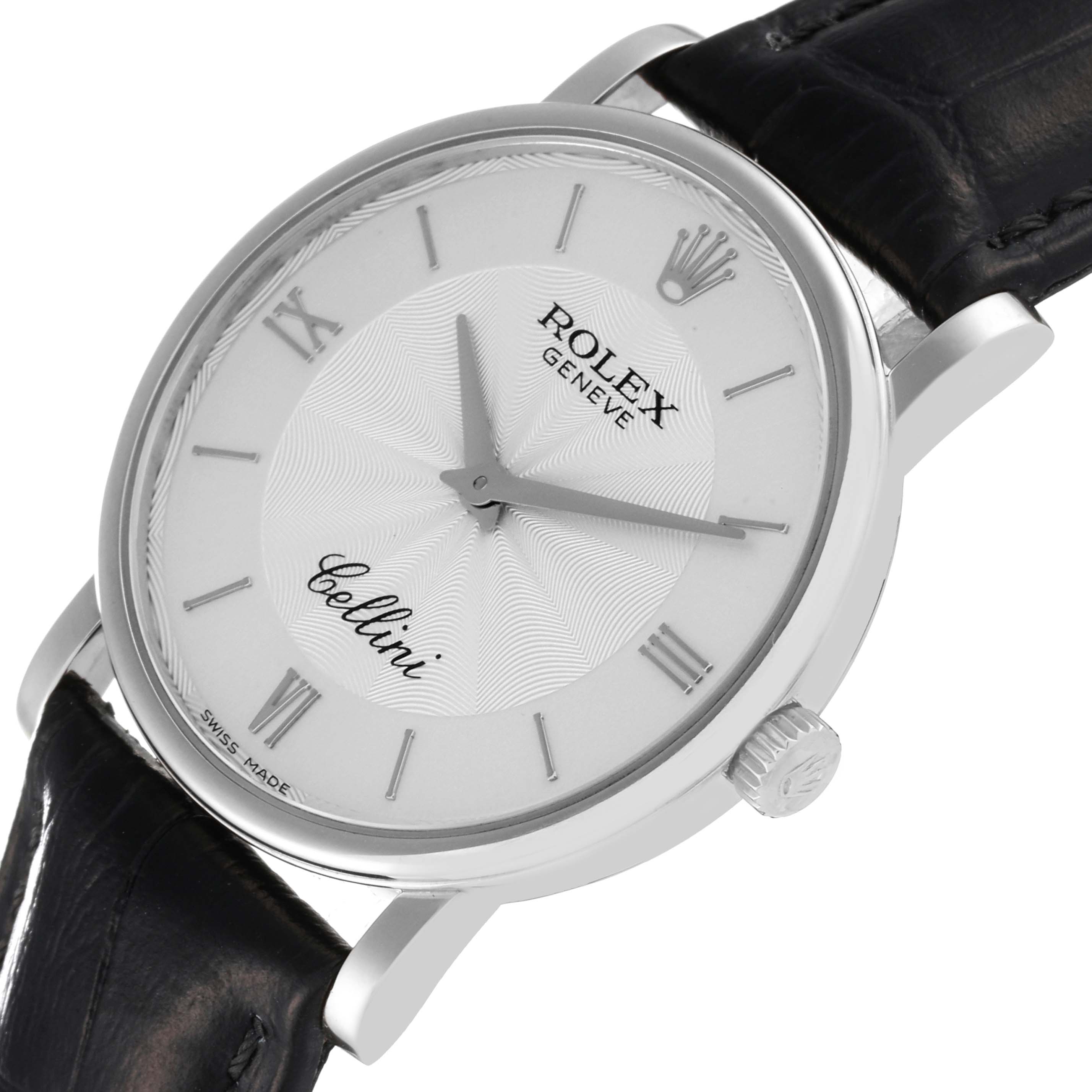 The image shows a Rolex Cellini 5115 Men
s White Gold Silver Dial 5115 Men
s White Gold Silver Dial watch from an angled top view, highlighting the dial, crown, case, and leather strap.