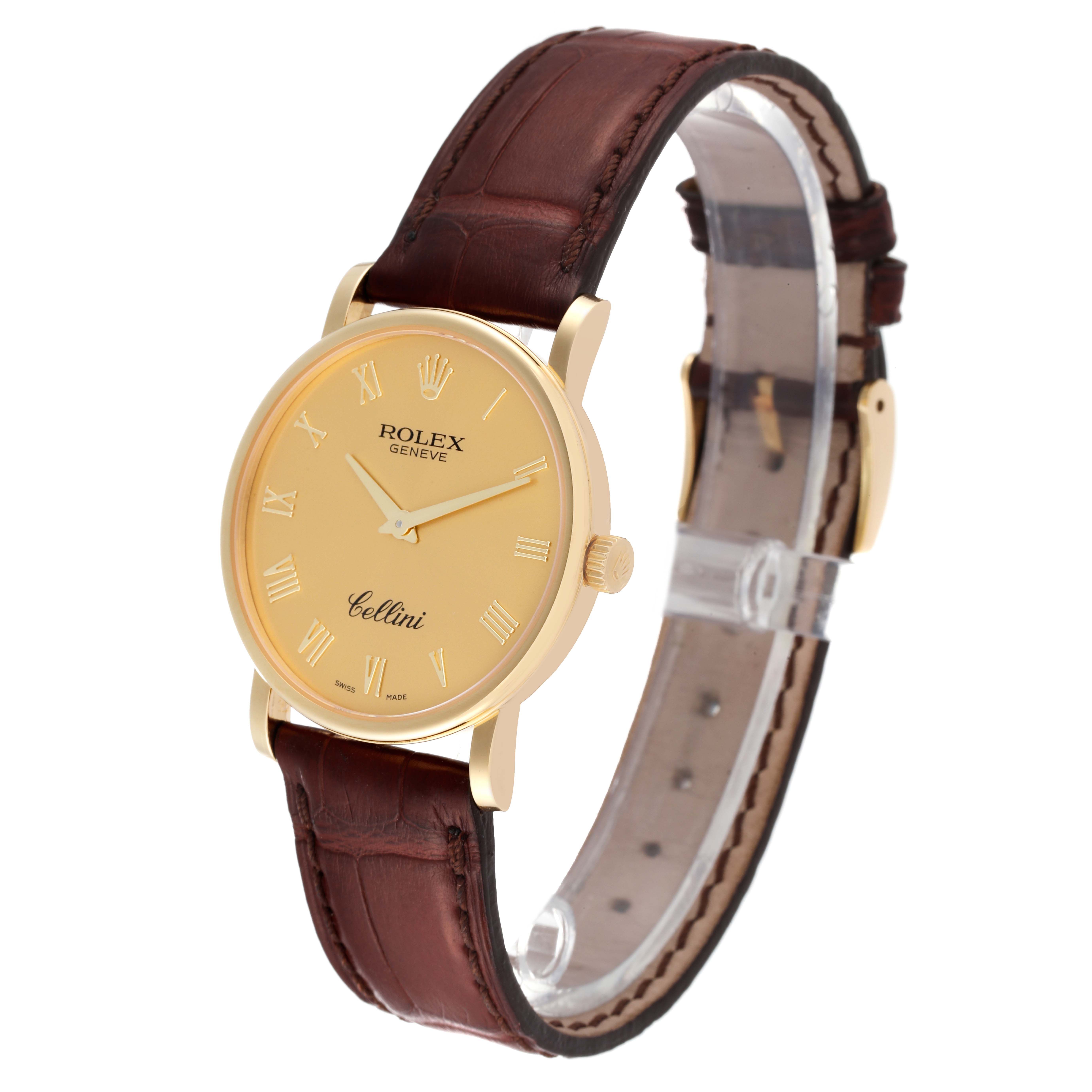 The image shows a Rolex Cellini 5115 Men's Yellow Gold Champagne Dial 5115 Men's Yellow Gold Champagne Dial watch at a slight angle, highlighting its gold dial, brown leather strap, and side profile.