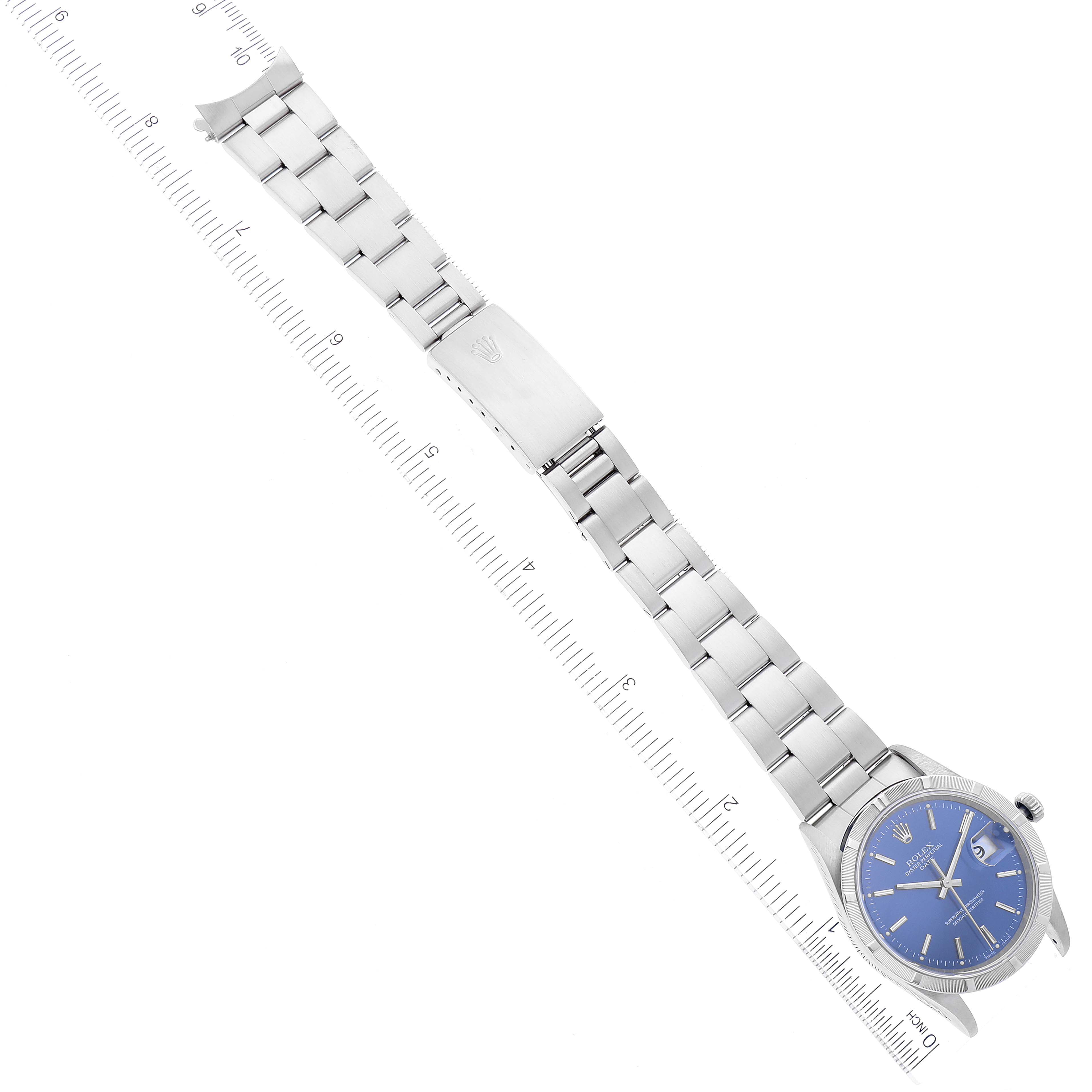 The image shows a Rolex Date 15210 Men's Stainless Steel Blue Dial 15210 Men's Stainless Steel Blue Dial model watch, including the full bracelet and clasp, displayed alongside a ruler for size reference.