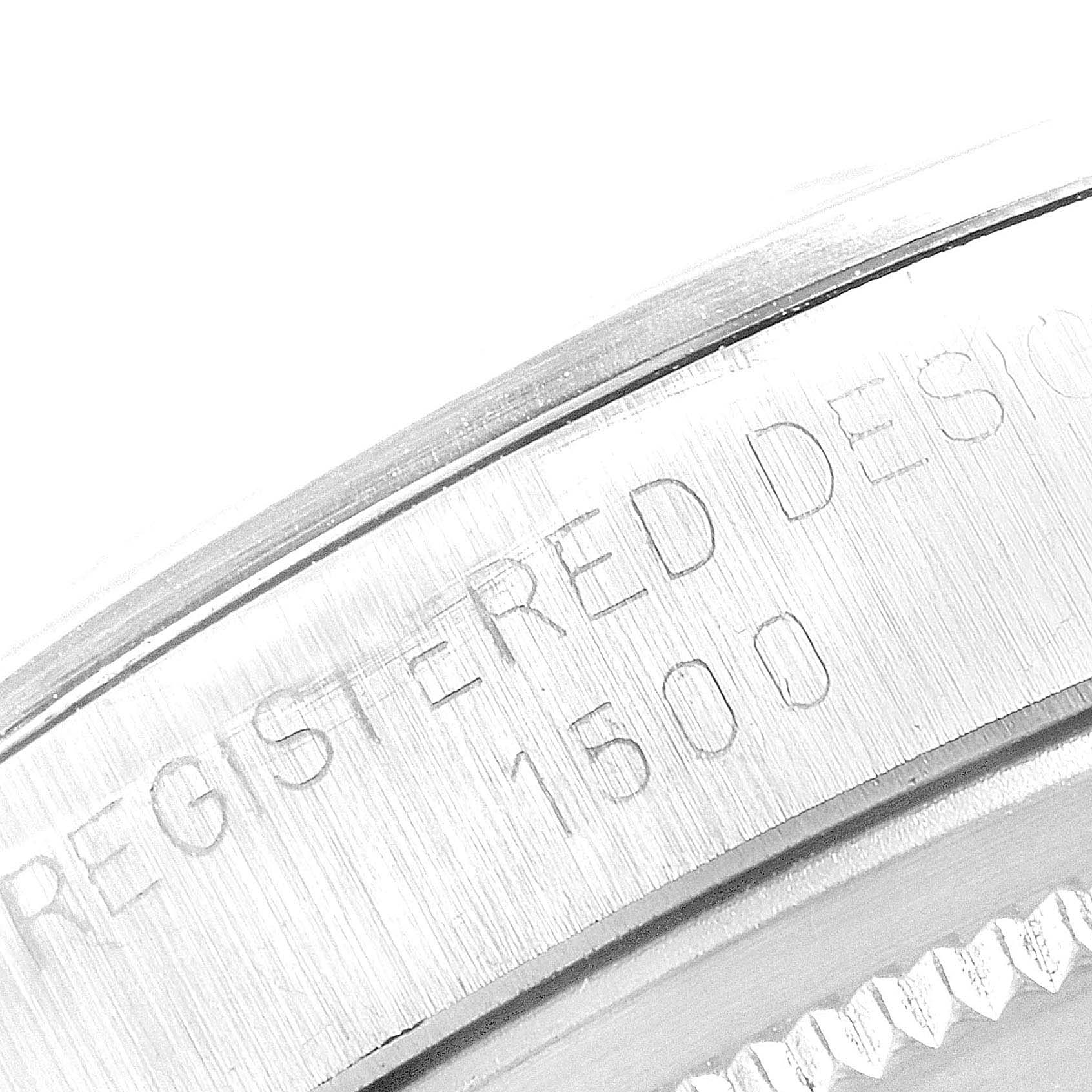 This image shows a close-up view of the bezel and case edge of the Rolex Date 1500 Men's Stainless Steel Silver Dial 1500 Men's Stainless Steel Silver Dial model, displaying the engraved text and model number.