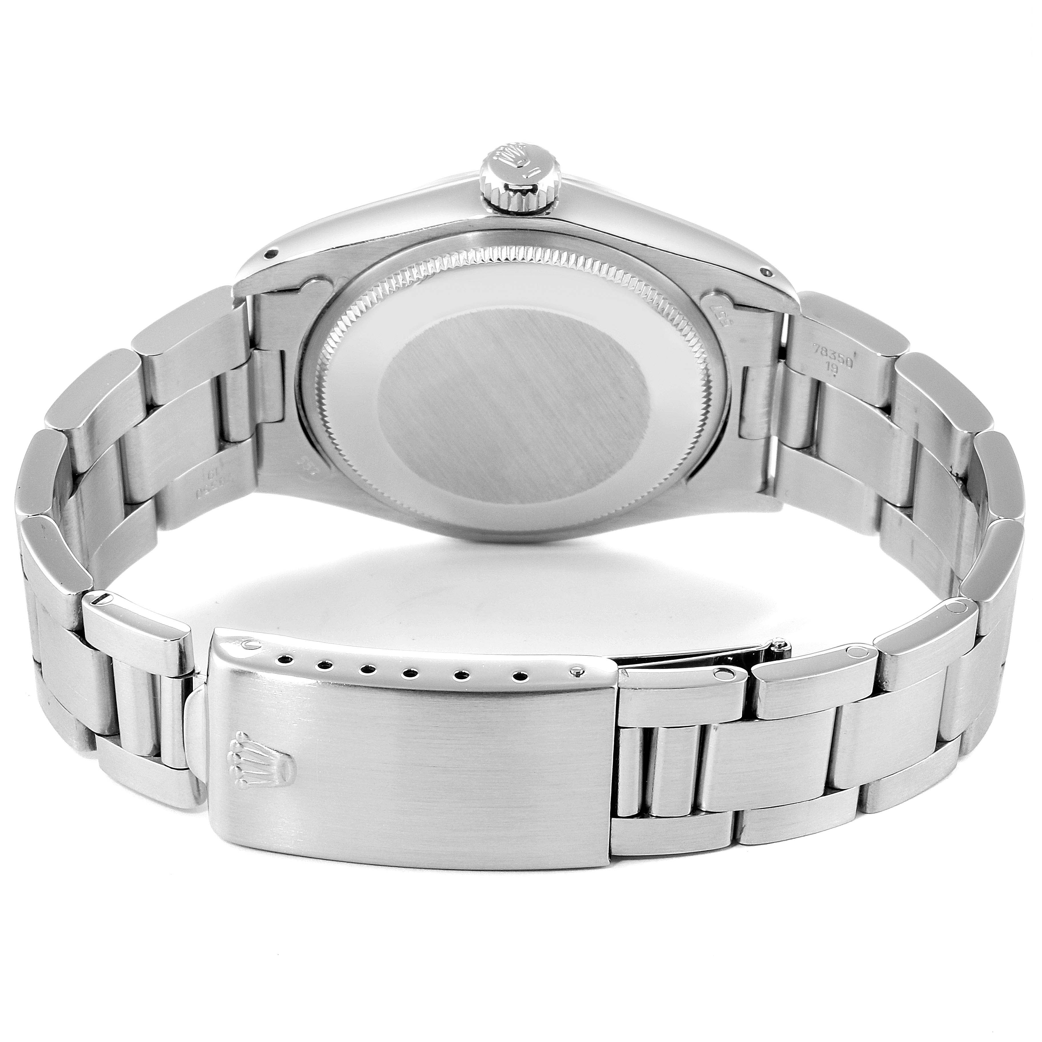 This image shows the back view of a Rolex Date 1500 Men's Stainless Steel Silver Dial 1500 Men's Stainless Steel Silver Dial model watch, including the case back, bracelet, and clasp.
