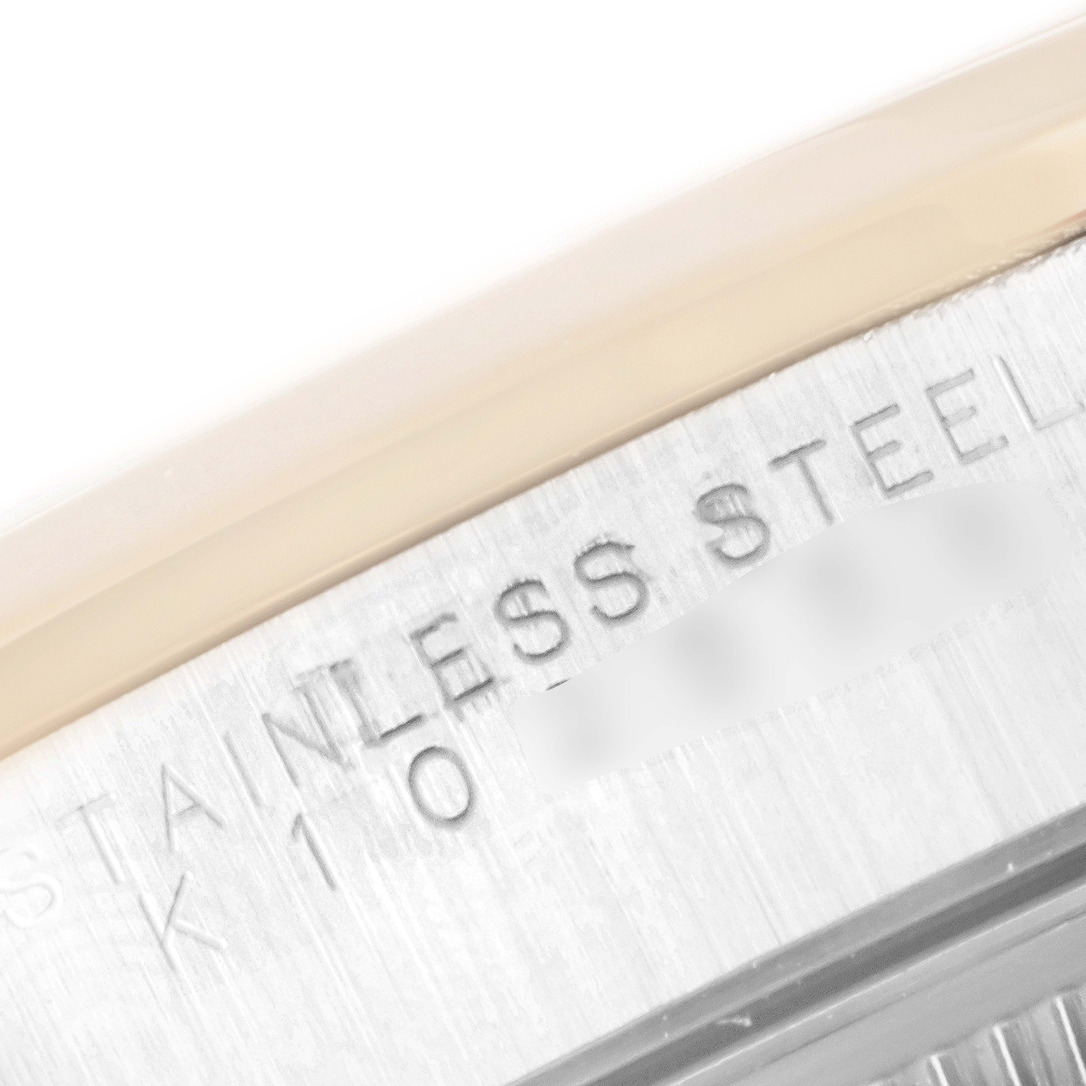 The image shows a close-up angle of the stainless steel engraving on the case back of a Rolex Date 15203 Men's Steel and Gold (two tone) White Dial 15203 Men's Steel and Gold (two tone) White Dial model watch.