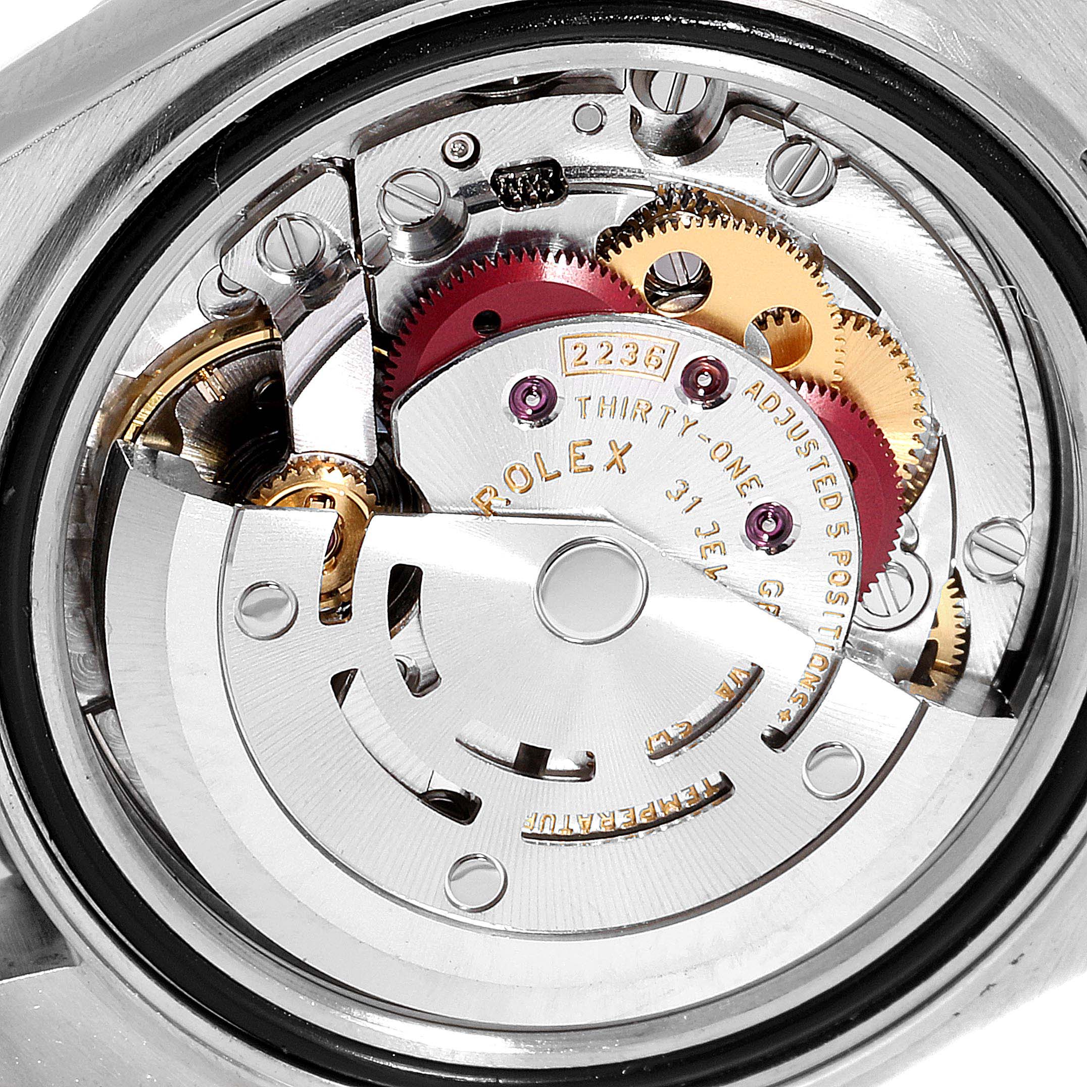 This image shows a close-up, back view of the inner mechanism of a Rolex Datejust 279383 Women
s Steel and Gold (two tone) Champagne Dial 279383 Women
s Steel and Gold (two tone) Champagne Dial watch displaying its intricate gears.