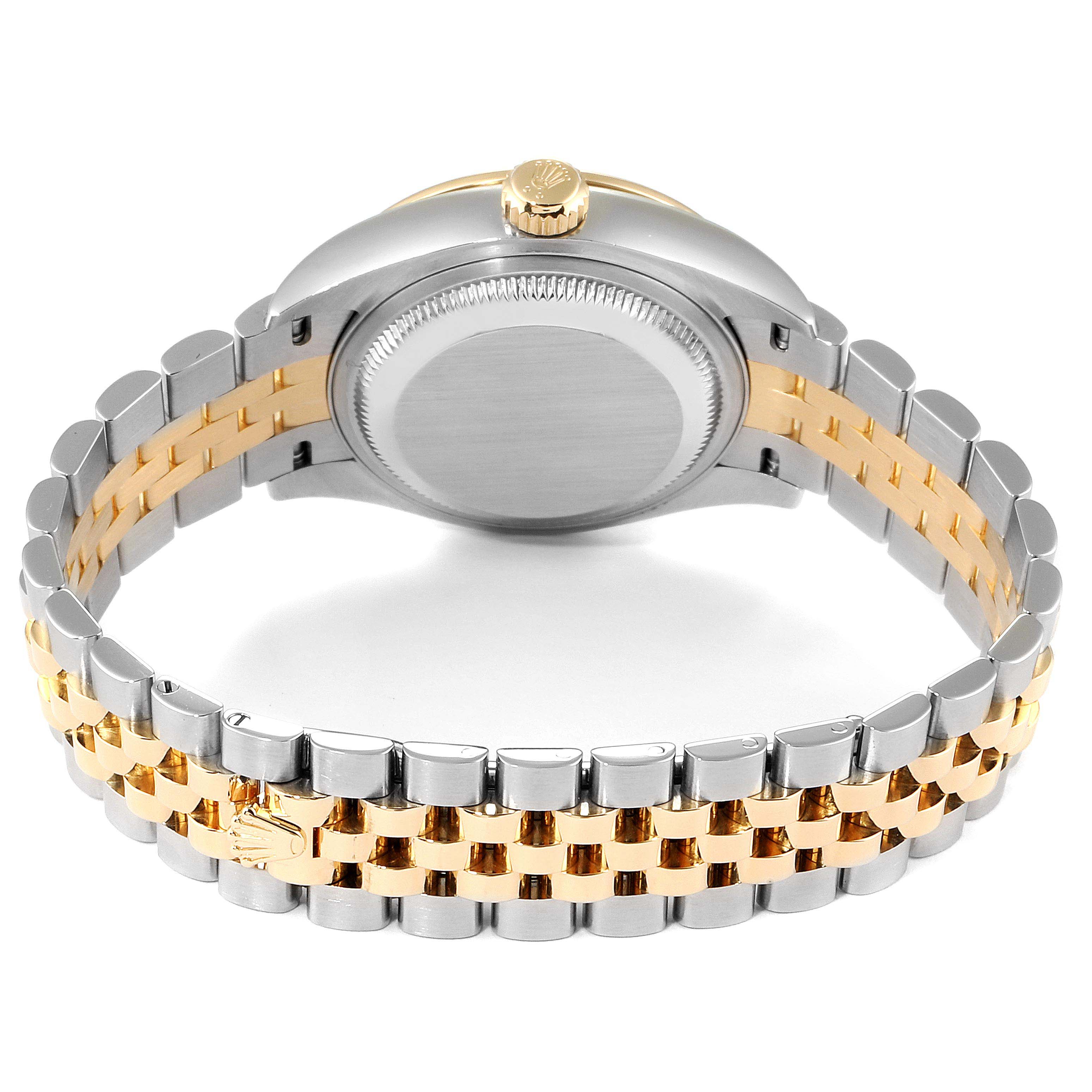 The image shows the back of a Rolex Datejust 279383 Women
s Steel and Gold (two tone) Champagne Dial 279383 Women
s Steel and Gold (two tone) Champagne Dial watch with a bi-metal bracelet and the crown.