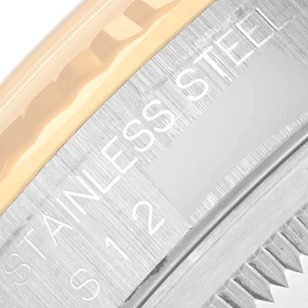 This close-up angle shows the engraved text on the bezel and case of a Rolex Datejust 16233 Men's Steel and Gold (two tone) Black Dial 16233 Men's Steel and Gold (two tone) Black Dial watch.