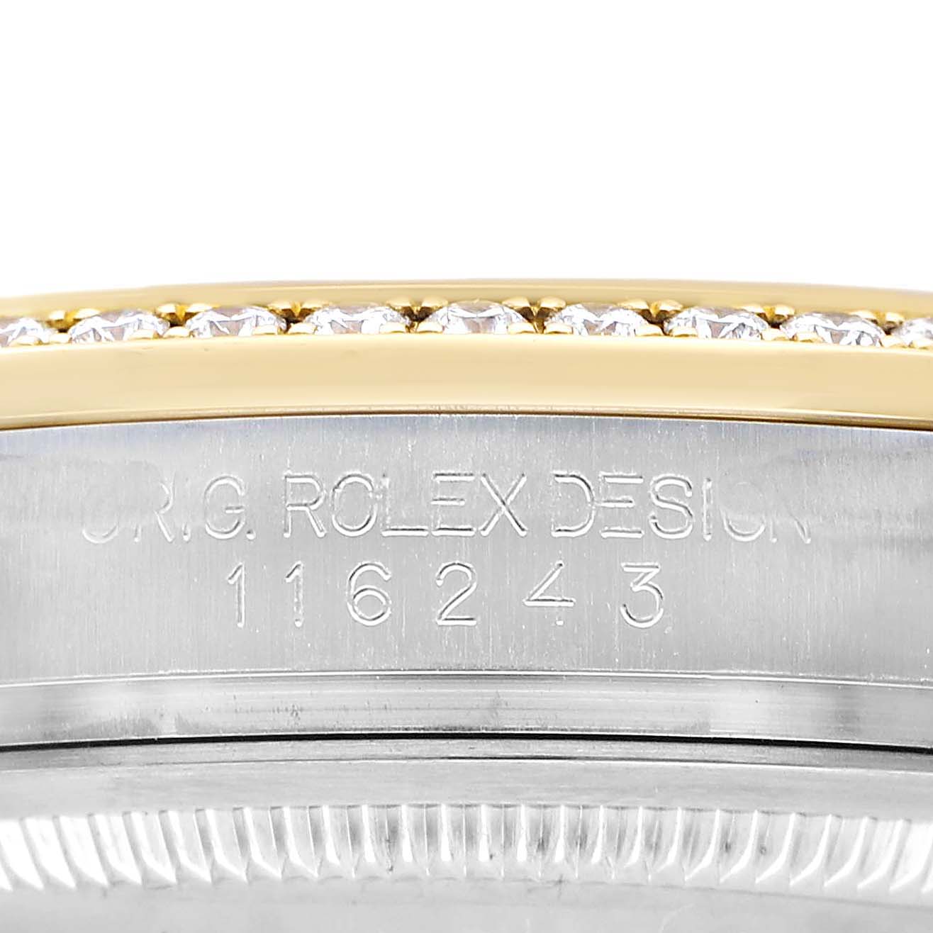 The image shows a close-up of the Rolex Datejust 116243 Men's Steel and Gold (two tone) Champagne Dial's engraved side and diamond-studded bezel.