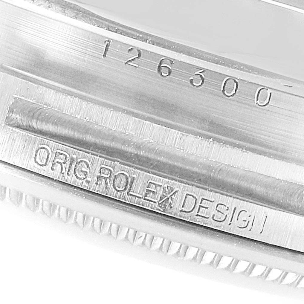 This image shows a close-up of the case side of a Rolex Datejust 41 126300 Men
s Stainless Steel Black Dial 126300 Men
s Stainless Steel Black Dial model, highlighting the model number 126300 and the "ORIG. ROLEX DESIGN" engraving.