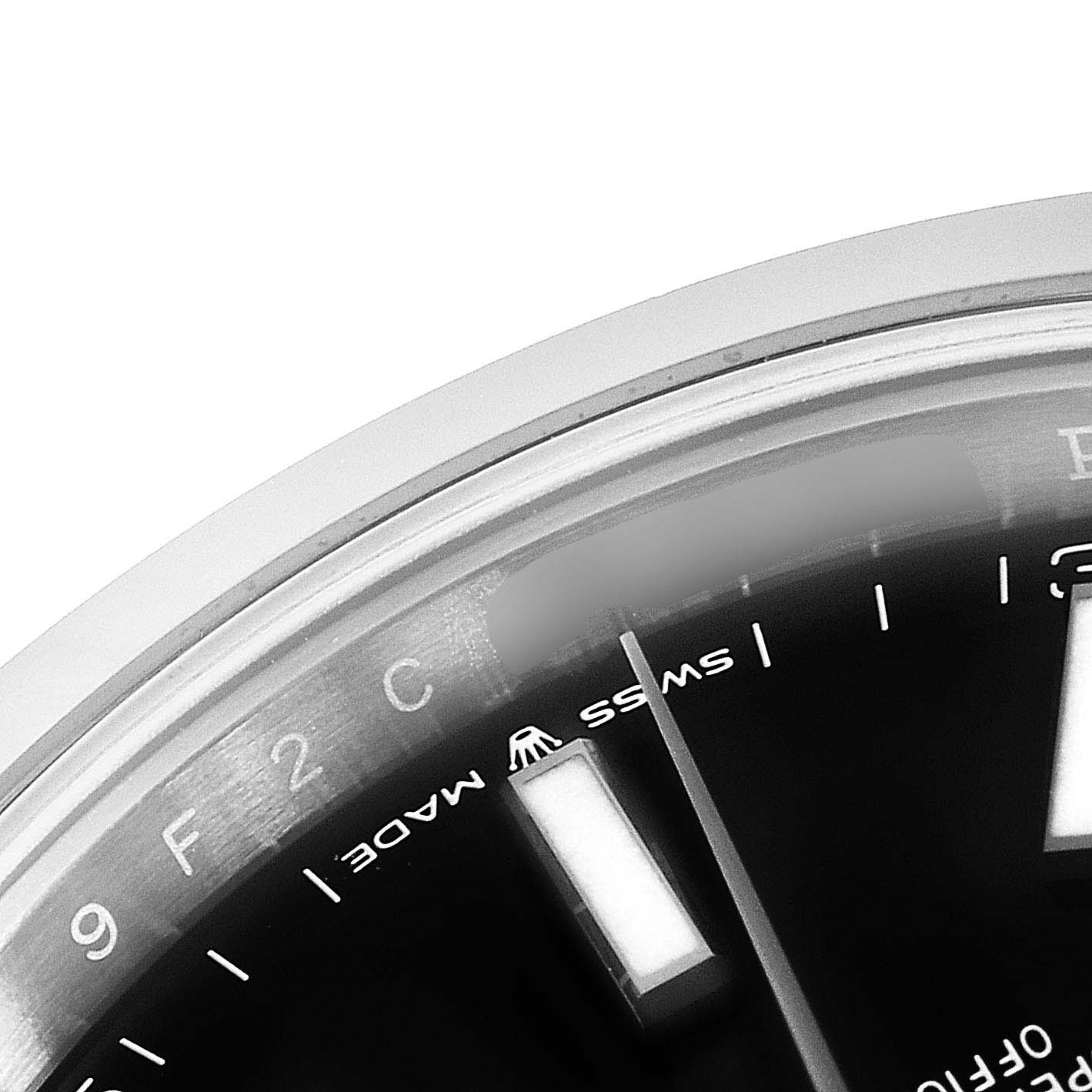 This close-up image of the Rolex Datejust 41 126300 Men
s Stainless Steel Black Dial 126300 Men
s Stainless Steel Black Dial watch shows a portion of the dial, including the "Swiss Made" text, a baton hour marker, and the chapter ring.