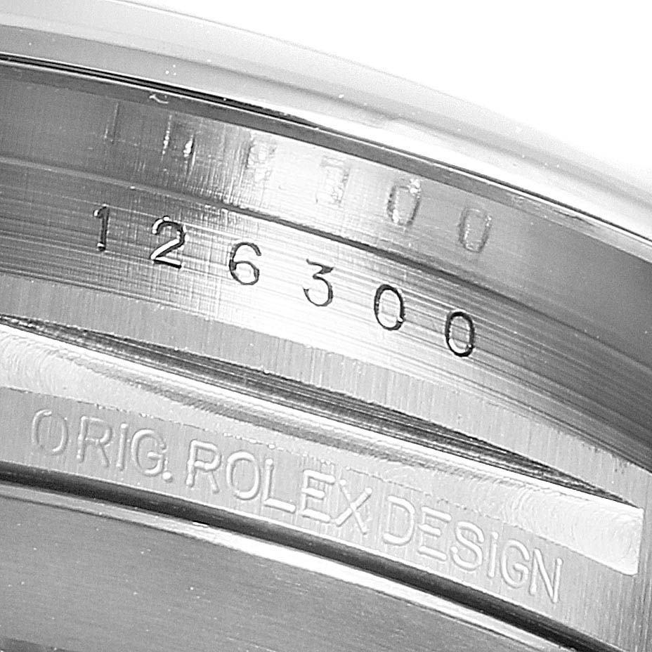 This close-up image of the Datejust 41 by Rolex shows the serial number and "ORIG. ROLEX DESIGN" engraving.
