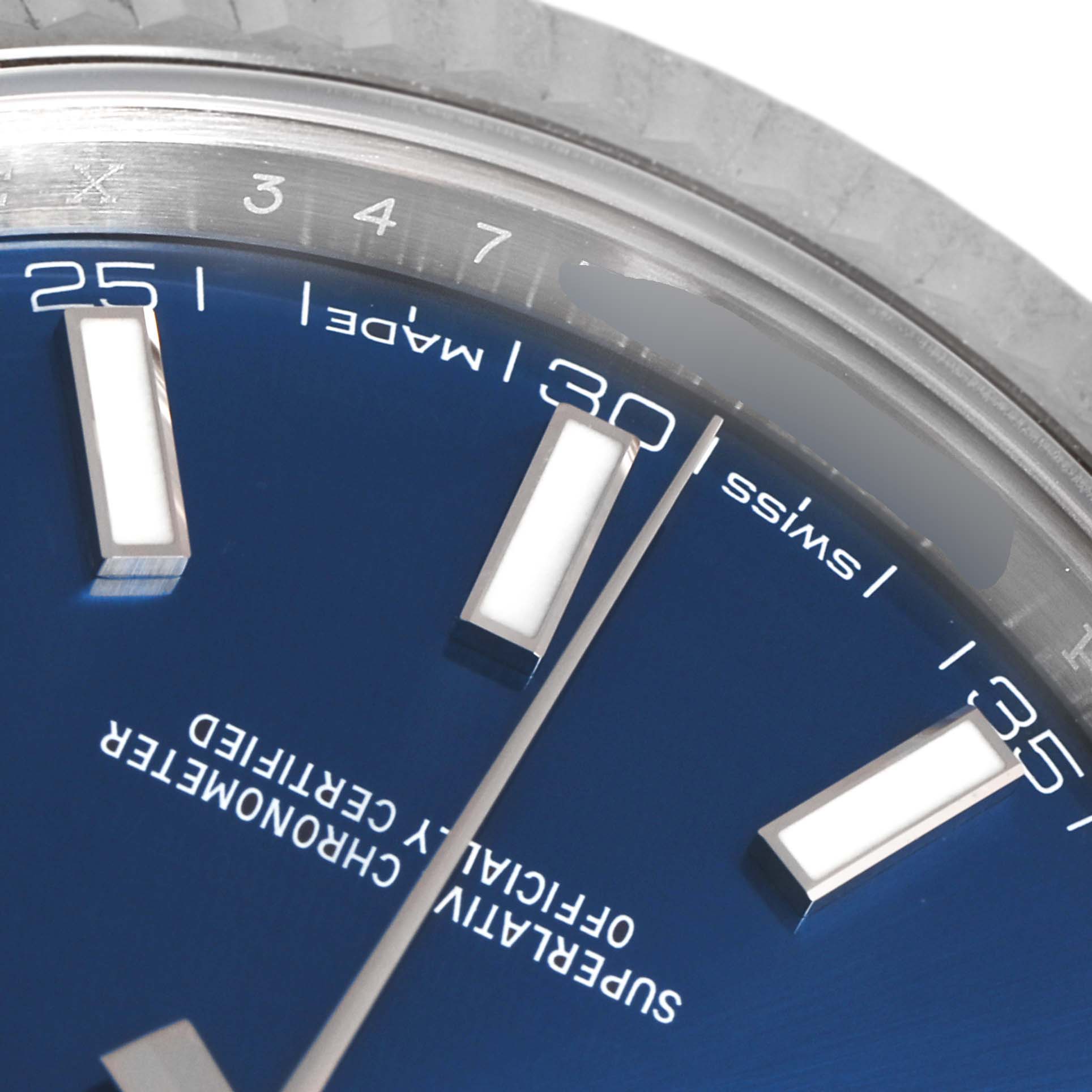 This close-up image shows part of the dial, markers, and bezel of a Rolex Datejust 41 126334 Men
s Stainless Steel Blue Dial 126334 Men
s Stainless Steel Blue Dial watch.