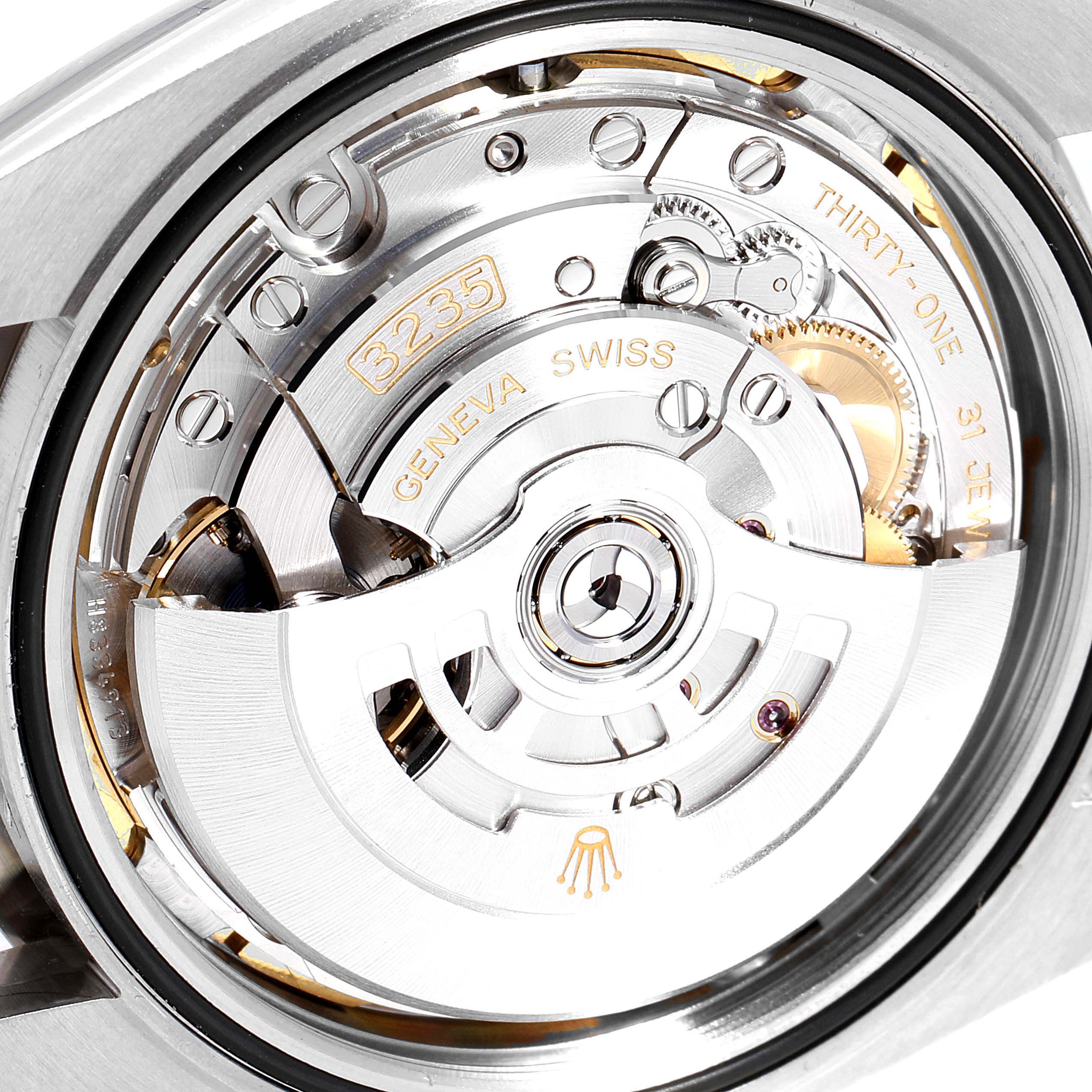 This image shows an up-close view of the movement mechanism in a Rolex Datejust 41 126334 Men
s Stainless Steel Blue Dial 126334 Men
s Stainless Steel Blue Dial watch, highlighting the intricate inner workings.