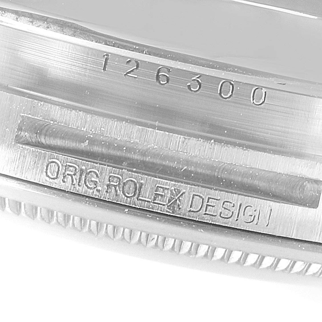 This close-up angle shows the engraved model number and "ORIG ROLEX DESIGN" inscription on a Rolex Datejust 41 126300 Men's Stainless Steel White Dial 126300 Men's Stainless Steel White Dial.