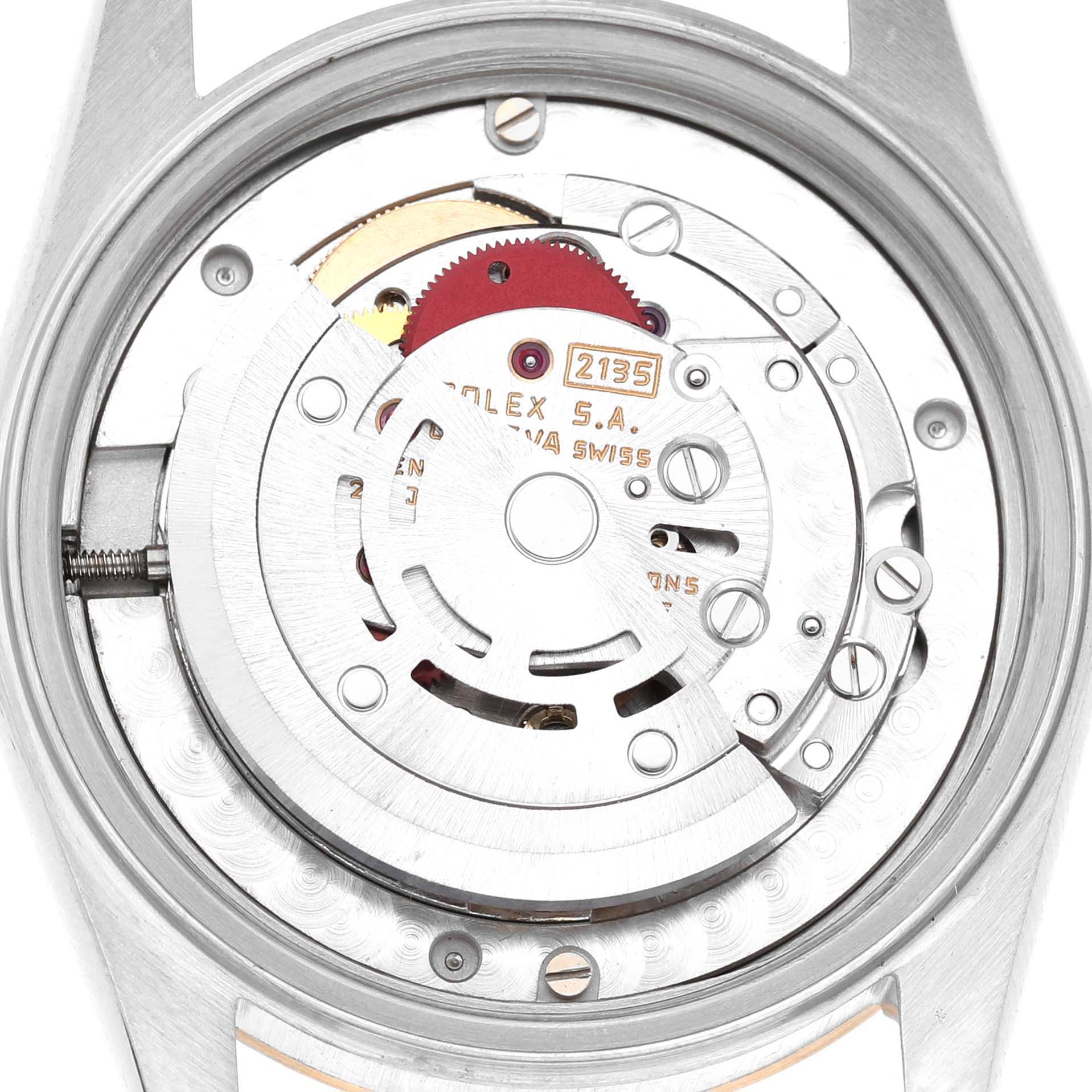 This image shows the movement of a Rolex Mid-Size 68273 Women's Stainless Steel Champagne Dial watch from a top-down angle, highlighting its intricate internal components.