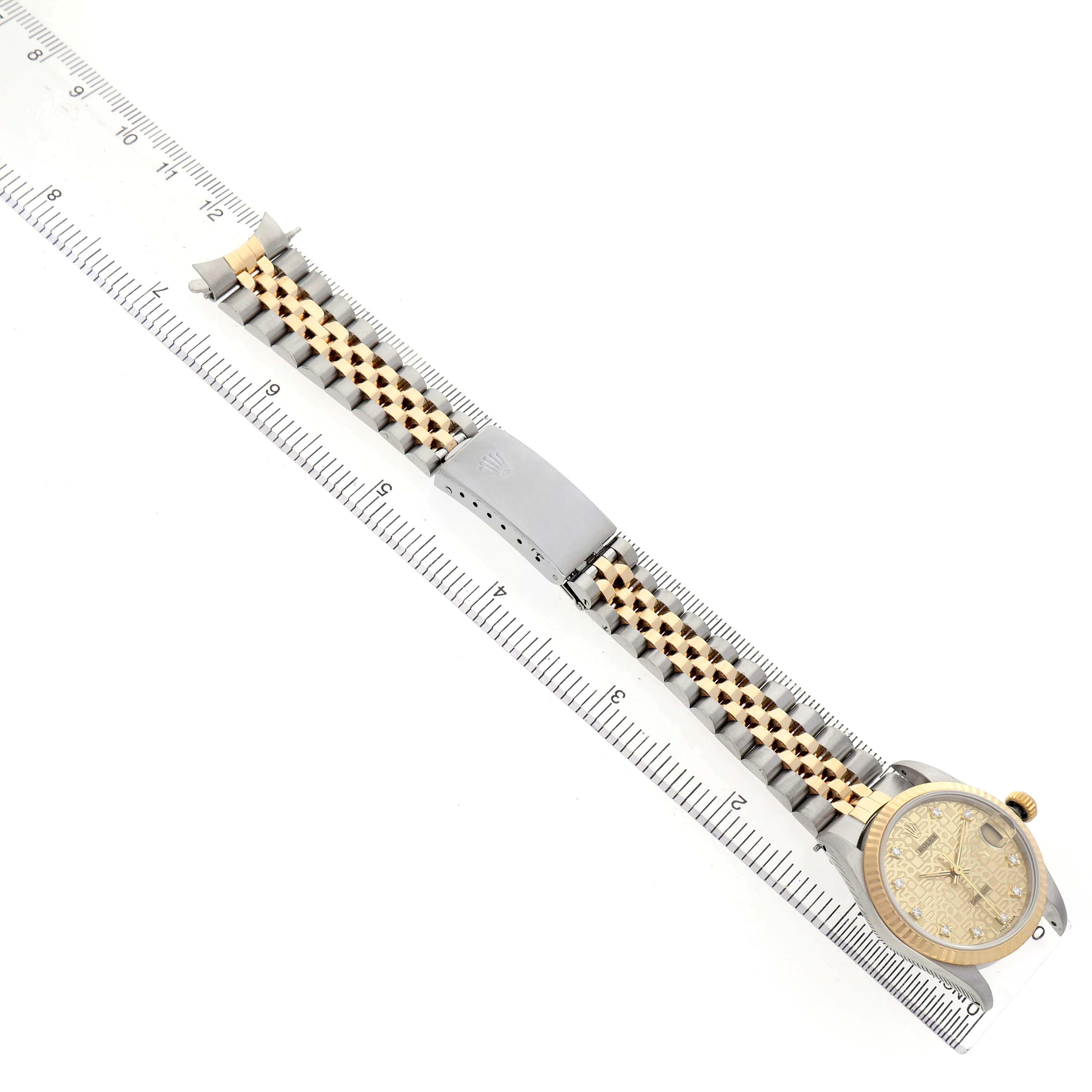 The Rolex Mid-Size 68273 Women's Stainless Steel Champagne Dial model watch is shown from above, highlighting the bracelet, clasp, and face.