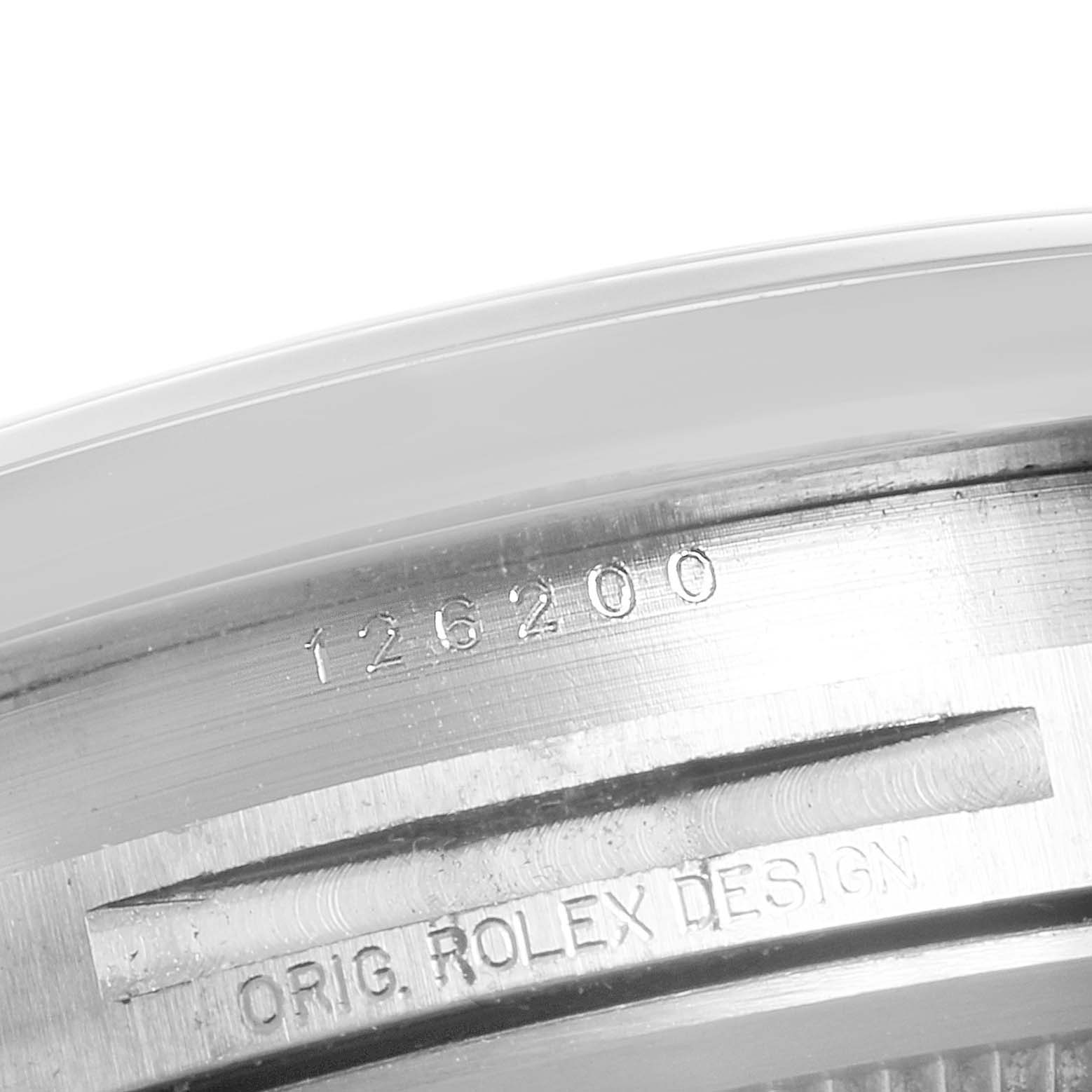 This image shows the engraved inner bezel of a Rolex Datejust 126200 Men's Stainless Steel Silver Dial 126200 Men's Stainless Steel Silver Dial model with the text "126200" and "ORIG. ROLEX DESIGN."