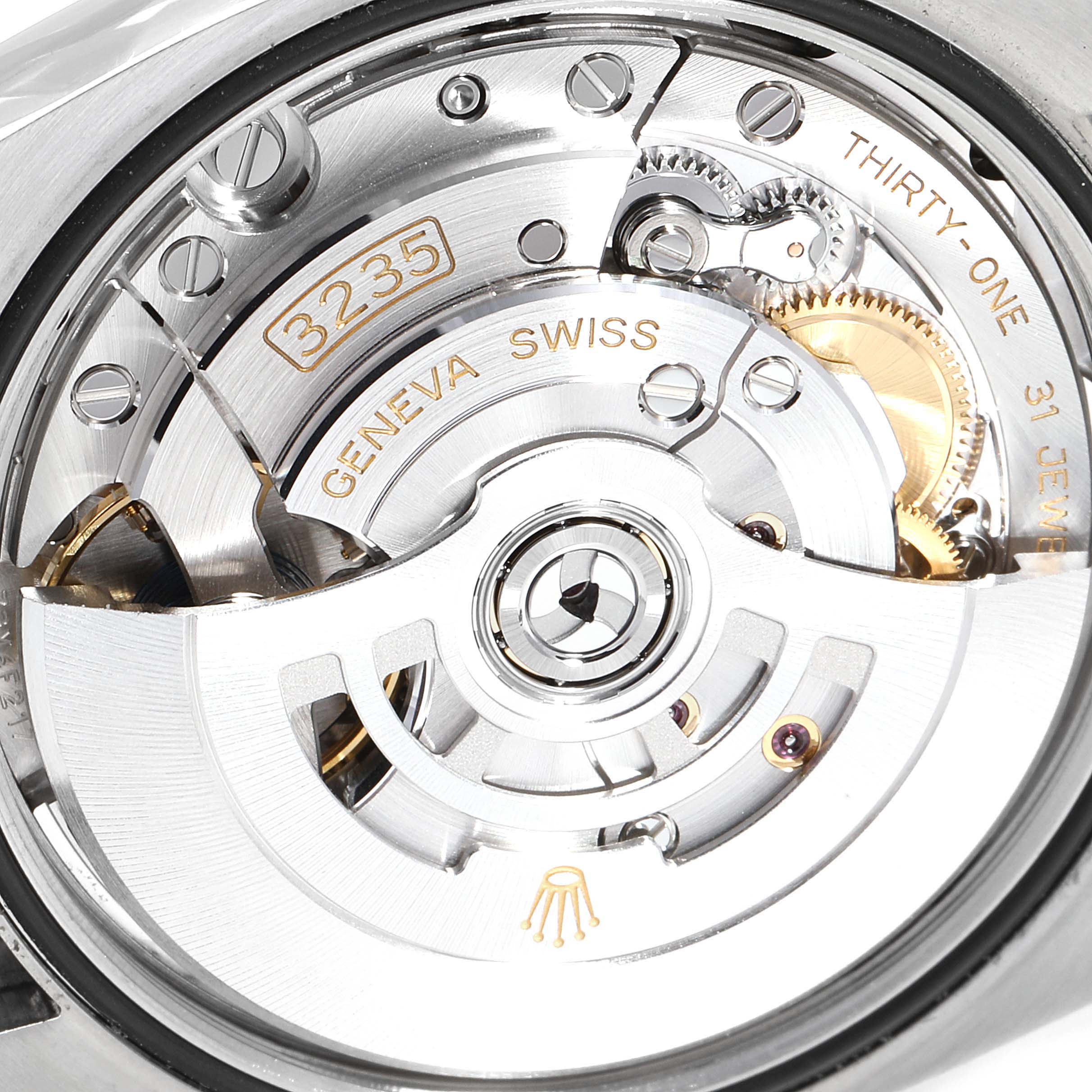 The image shows a close-up of the movement inside the Rolex Datejust 126200 Men's Stainless Steel Silver Dial 126200 Men's Stainless Steel Silver Dial, featuring its intricate mechanical parts.
