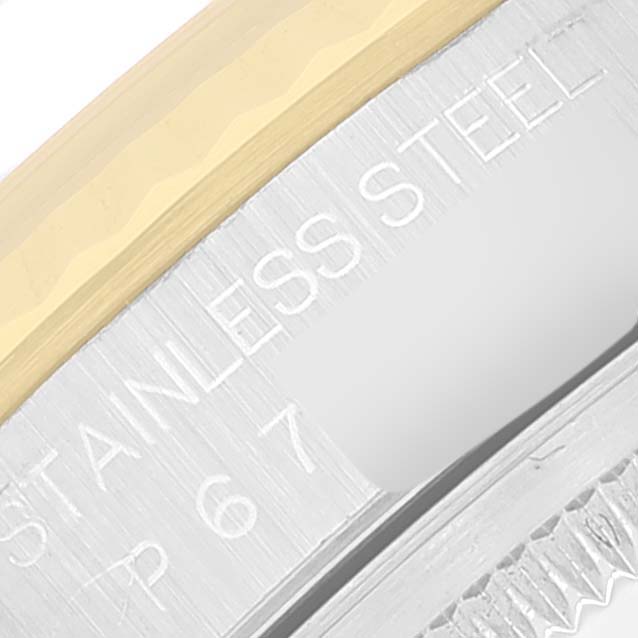 The image shows an angled close-up of the case side with “Stainless Steel” engraved on a Rolex Datejust 16233 Men's Steel and Gold (two tone) White Dial 16233 Men's Steel and Gold (two tone) White Dial model.