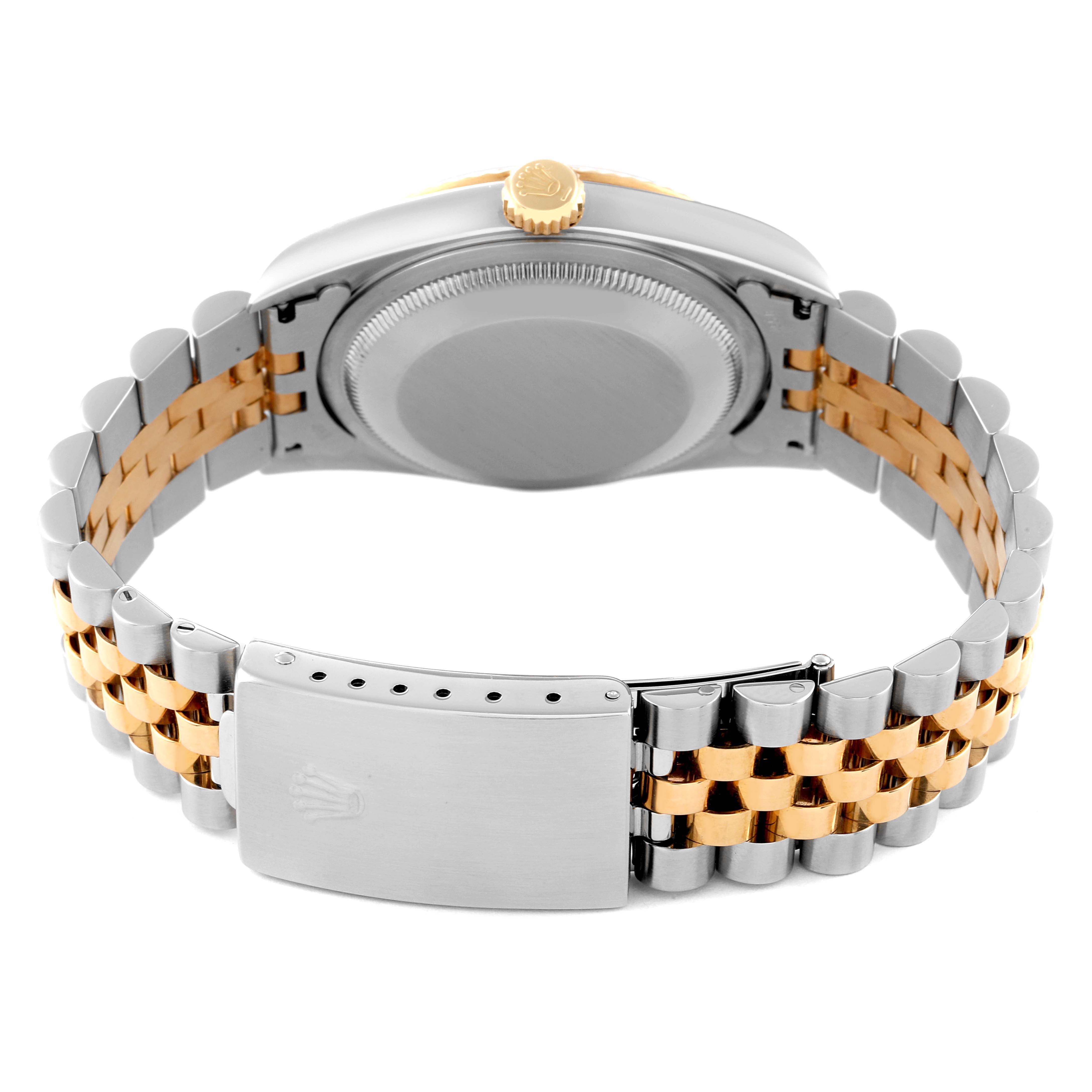 The image shows the back side of a Rolex Datejust 16233 Men's Steel and Gold (two tone) White Dial 16233 Men's Steel and Gold (two tone) White Dial watch, highlighting the case back, crown, and two-tone bracelet with clasp.