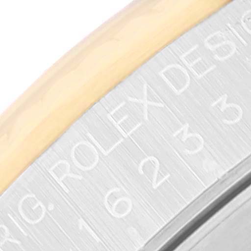The image shows a close-up angle of the bezel and edge of the case of a Rolex Datejust 16233 Men's Steel and Gold (two tone) White Dial 16233 Men's Steel and Gold (two tone) White Dial watch.