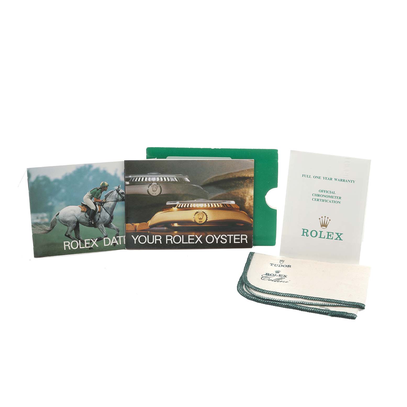 The image shows accessories for the Rolex Vintage Collection 16014 Men
s Stainless Steel Black Dial, including booklets, warranty card, and a cleaning cloth.