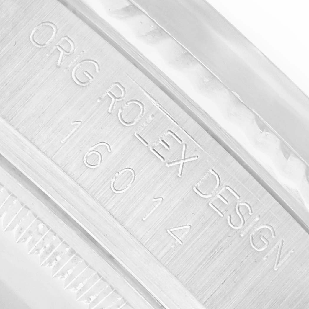 The image shows an angled close-up of the engraved side, featuring the serial/model number of the Rolex Vintage Collection 16014 Men
s Stainless Steel Black Dial watch.