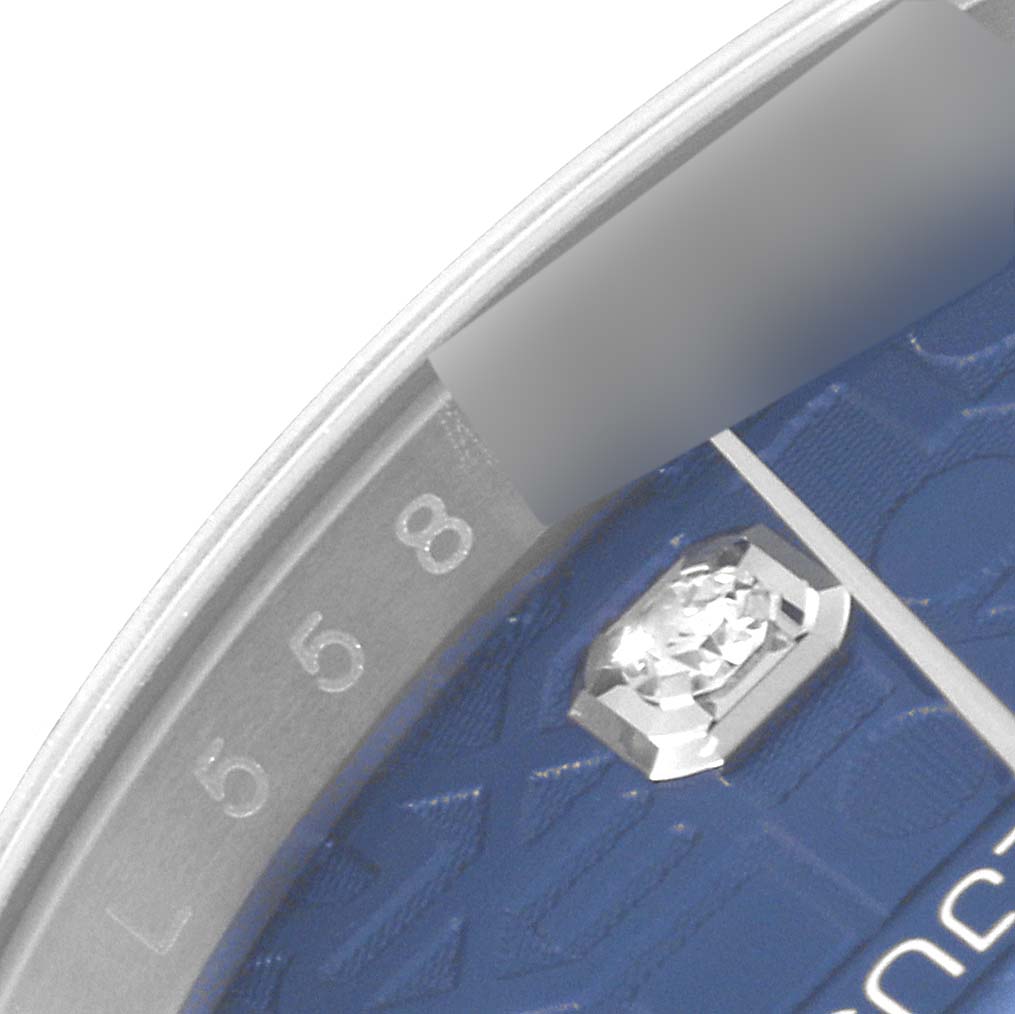This image shows a close-up of the dial, including a diamond marker and the 5 and 8-hour markers of a Rolex Datejust 126234 Men's Stainless Steel Blue Dial 126234 Men's Stainless Steel Blue Dial watch.