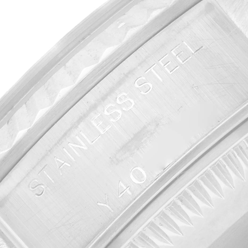 The image shows an angled view of the stainless steel case back engraving on a Rolex Datejust 79174 Women
s Stainless Steel White Dial watch.
