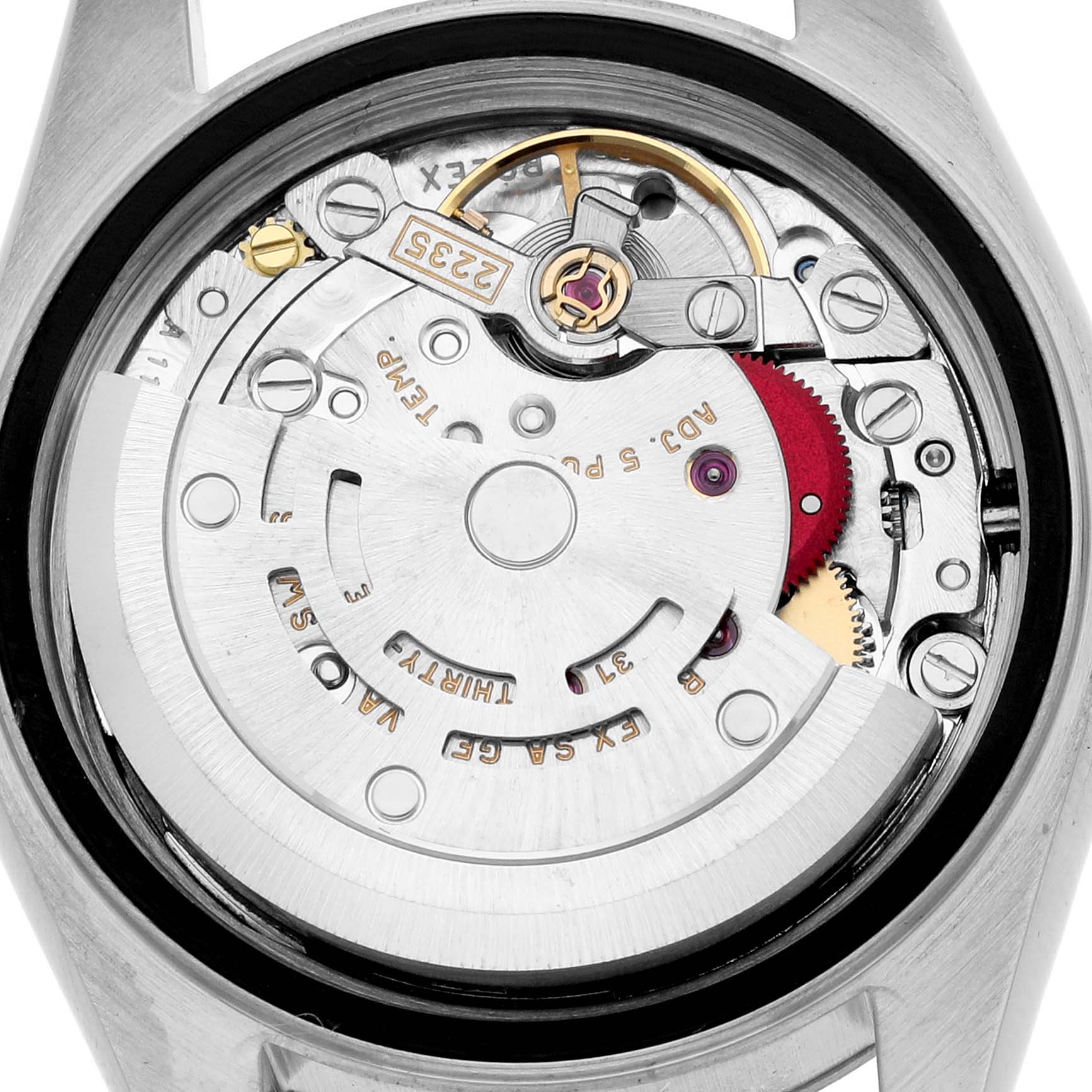 The image shows the back view of a Rolex Datejust 79174 Women
s Stainless Steel White Dial
s movement, highlighting gears and internal components.