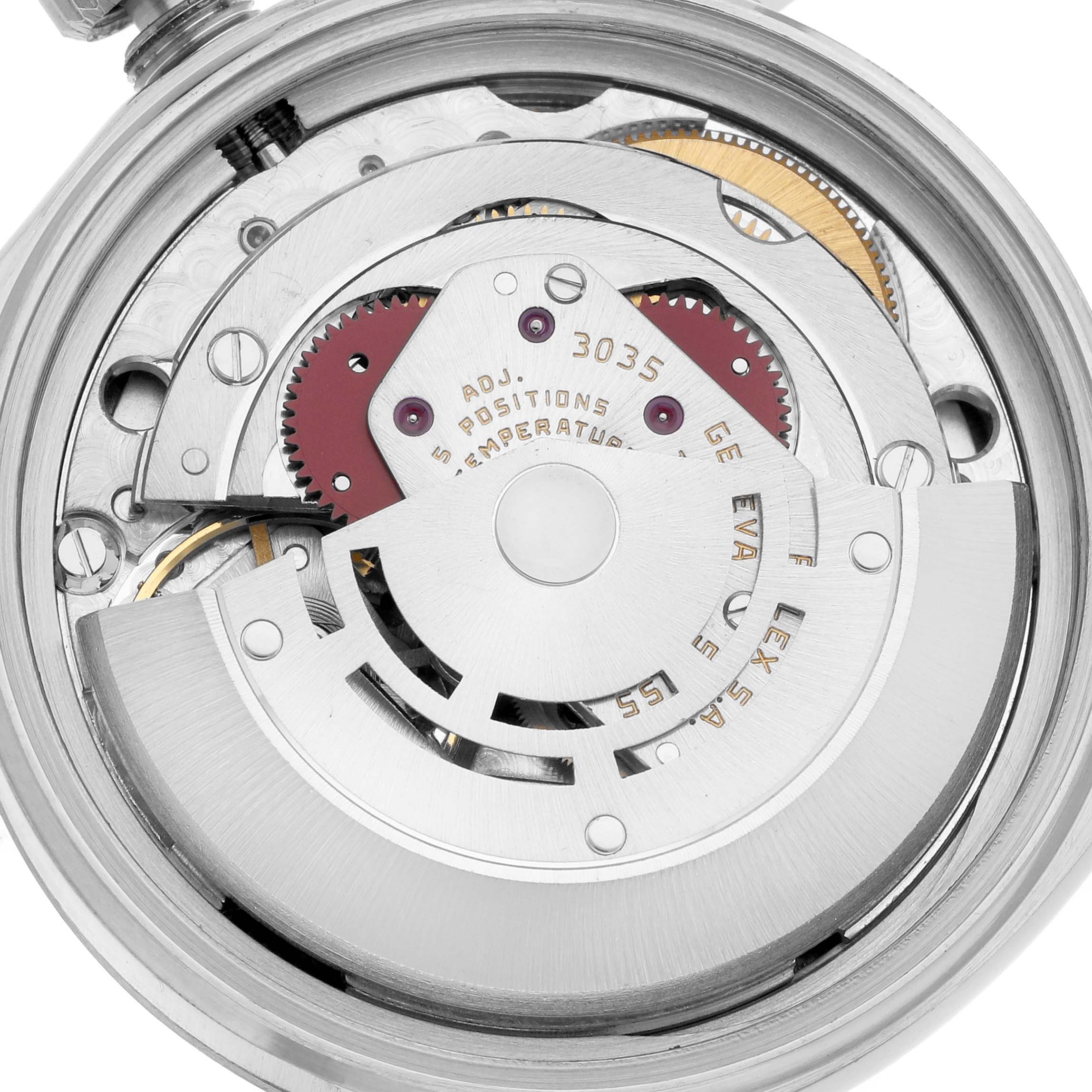 The image shows the internal mechanism of a Rolex Vintage Collection 16014 Men
s Stainless Steel Silver Dial watch, displaying gears and a rotor from the back.