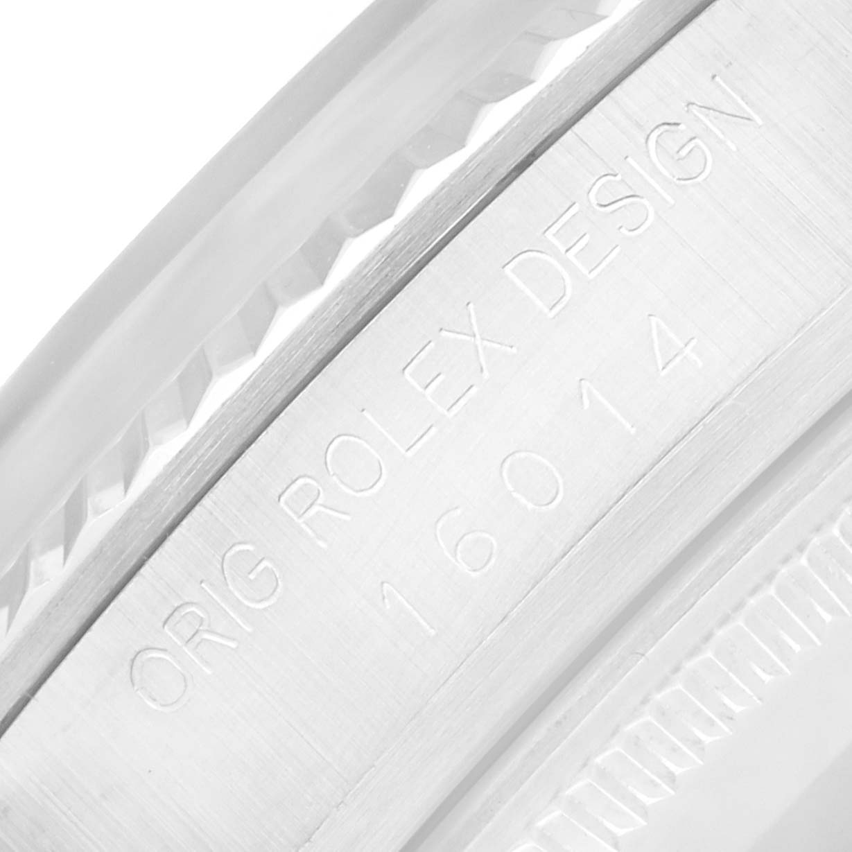 The image shows a close-up of the side engraving on a Rolex Vintage Collection 16014 Men
s Stainless Steel Silver Dial watch, displaying model details.