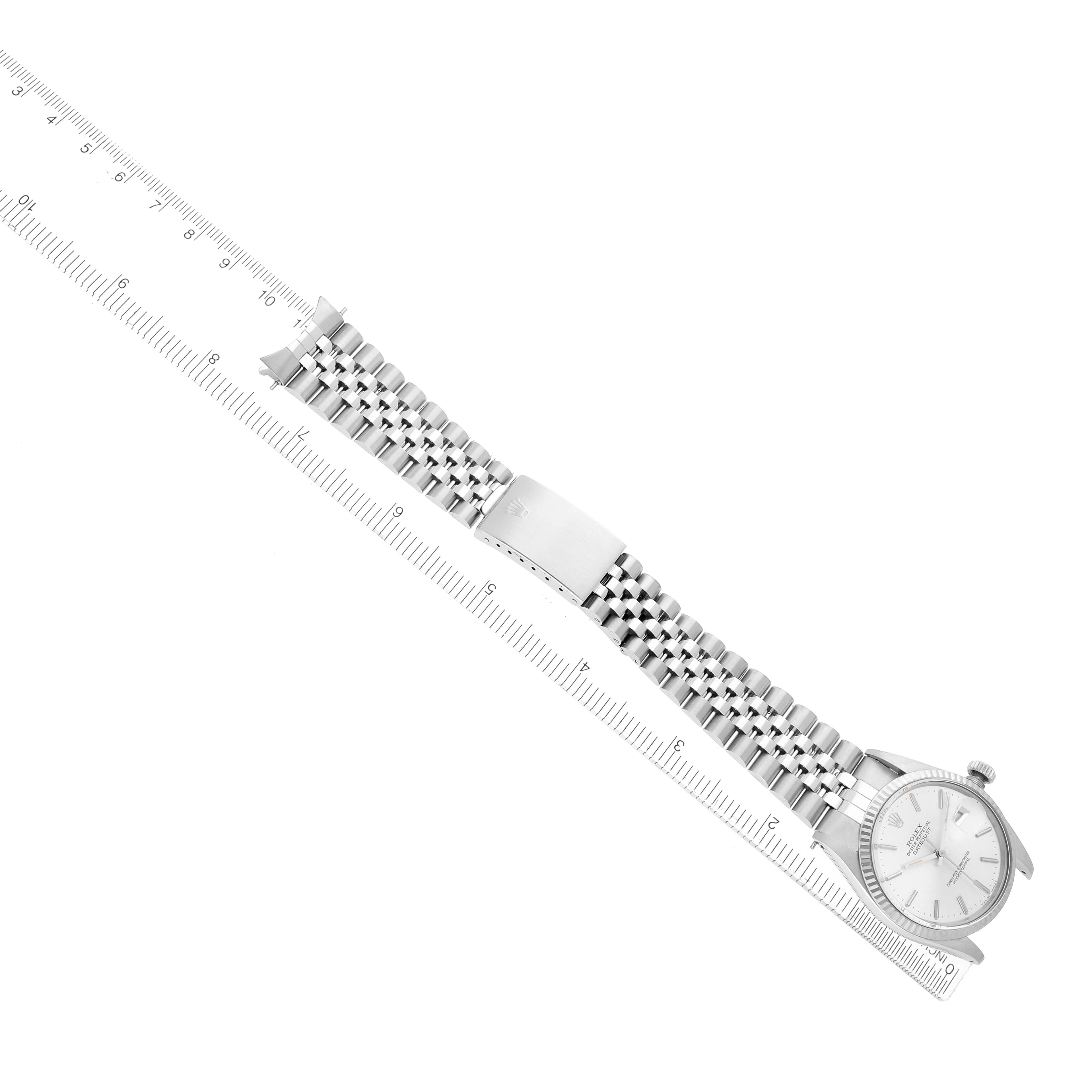 The Vintage Collection Rolex watch is shown from a top-down angle, highlighting the full bracelet, clasp, and watch face.