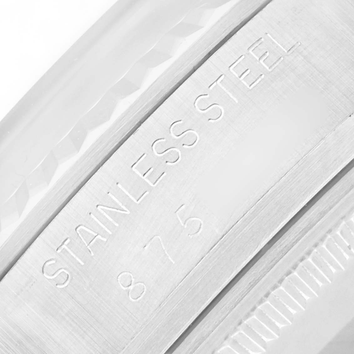 The image shows a close-up of the stainless steel engraving on a Rolex Vintage Collection 16014 Men
s Stainless Steel Silver Dial watch case.