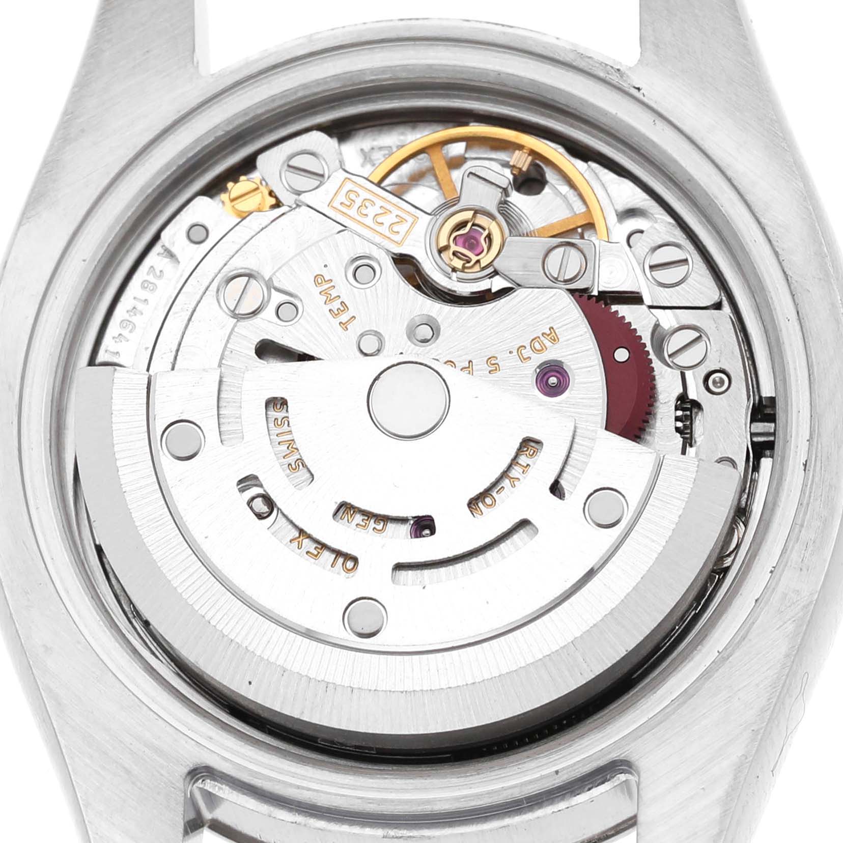 The image shows the movement of a Rolex Datejust 179174 Women's Stainless Steel Silver Dial watch viewed from the back, highlighting its intricate mechanical components.