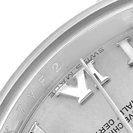 The image shows a close-up of the Rolex Datejust 179174 Women's Stainless Steel Silver Dial’s dial, focusing on the Roman numerals and part of the bezel.