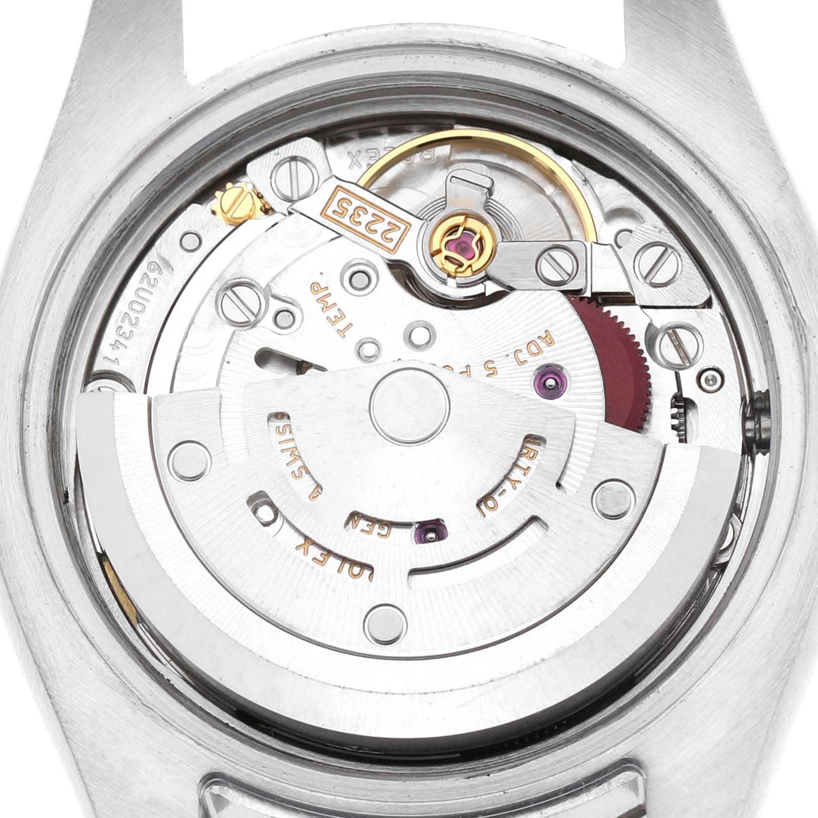 The image shows the internal movement of a Rolex Datejust 179174 Women's Stainless Steel Blue Dial, viewed from the back, highlighting the mechanism and components.