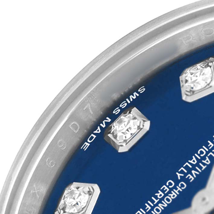 The image shows a close-up of the Rolex Datejust 179174 Women's Stainless Steel Blue Dial dial with diamond hour markers and part of the bezel.