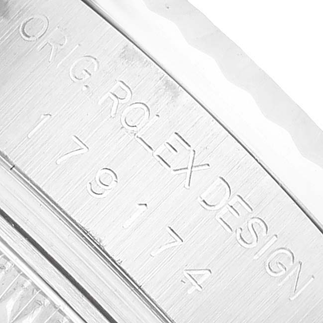 The image shows a close-up of the engraving on the side of a Rolex Datejust 179174 Women's Stainless Steel White Dial watch case.
