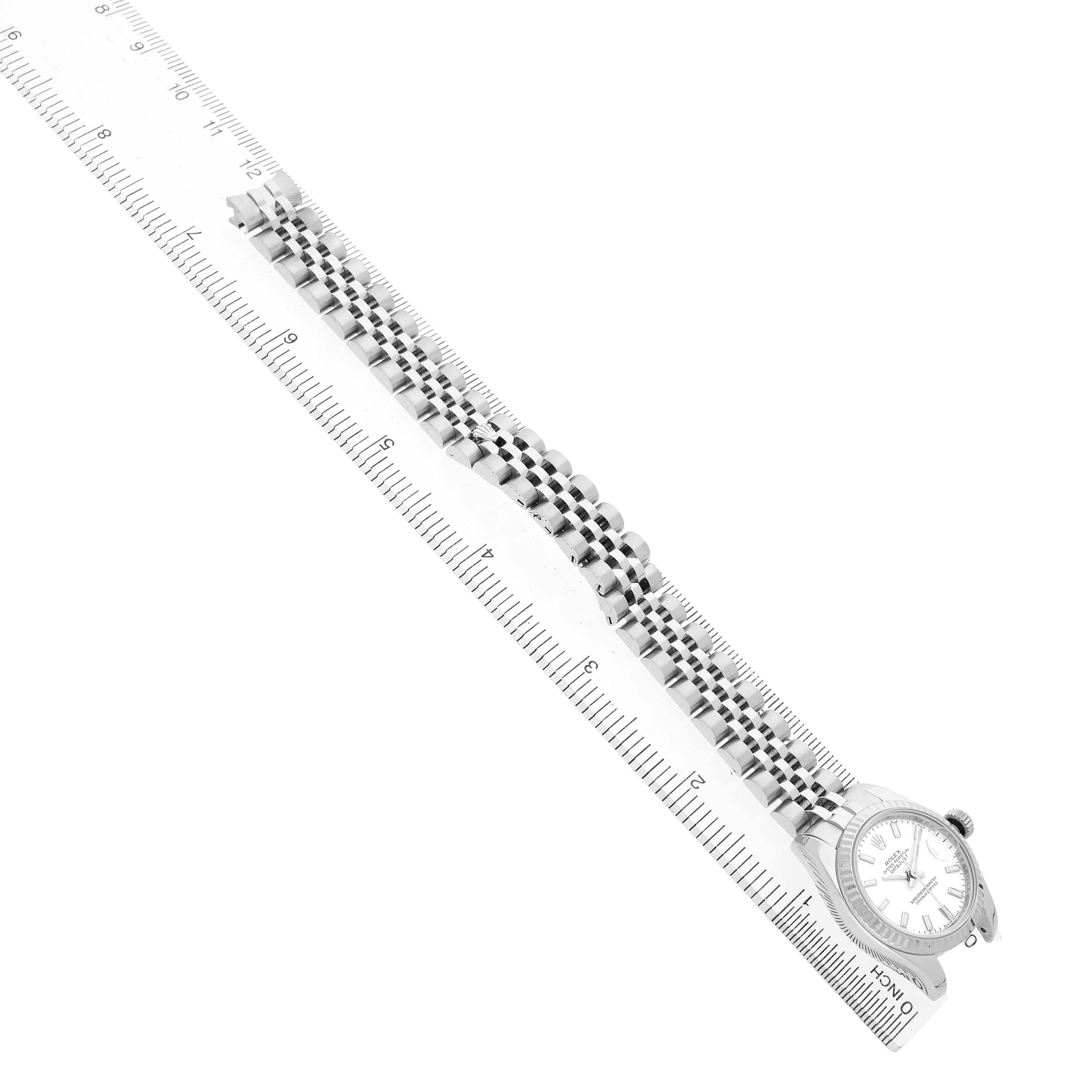 The Rolex Datejust 179174 Women's Stainless Steel White Dial watch is shown from a diagonal angle, highlighting the face and full length of the bracelet.