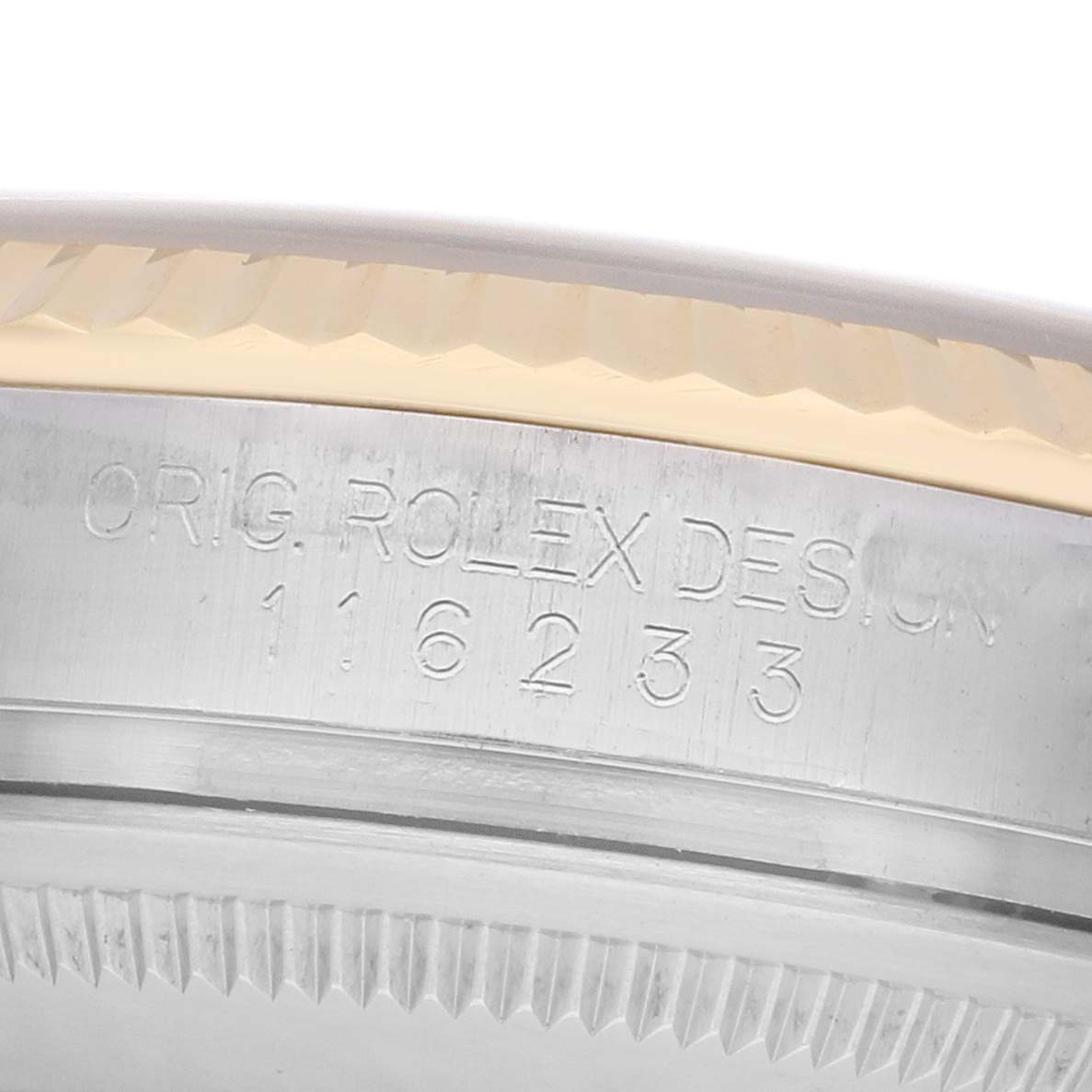 The image shows a close-up of the case side of a Rolex Datejust 116233 Men
s Steel and Gold (two tone) Champagne Dial, highlighting the engraved model and serial numbers.
