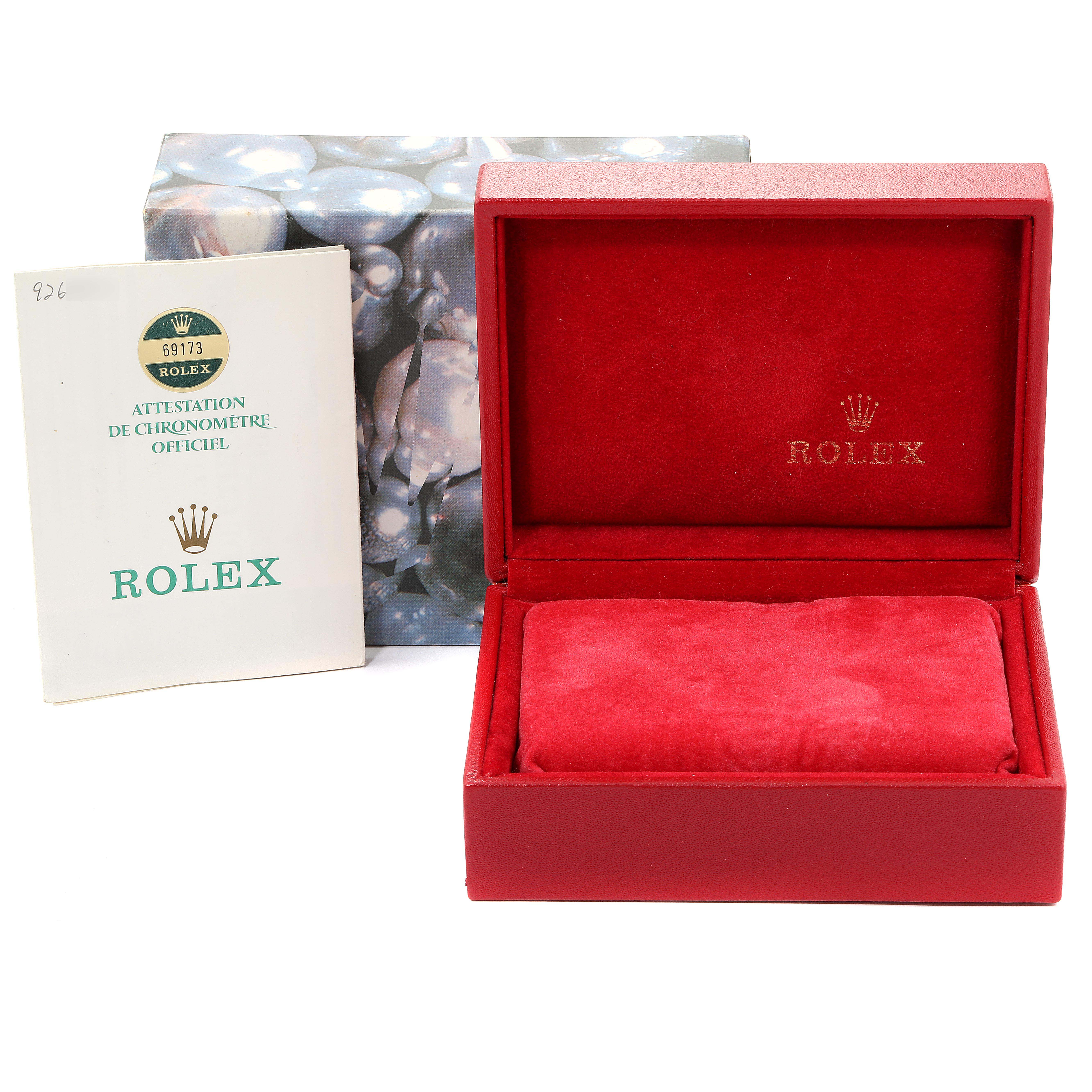 Displayed are the open red Rolex watch box and official booklet for the Rolex Datejust 69173 Women
s Steel and Gold (two tone) Champagne Dial 69173 Women
s Steel and Gold (two tone) Champagne Dial model.
