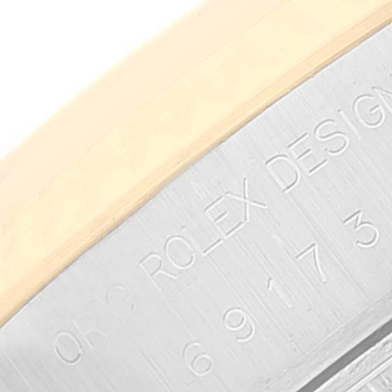 This image shows an engraving on the outer rim of a Rolex Datejust 69173 Women's Steel and Gold (two tone) Champagne Dial 69173 Women's Steel and Gold (two tone) Champagne Dial watch case.