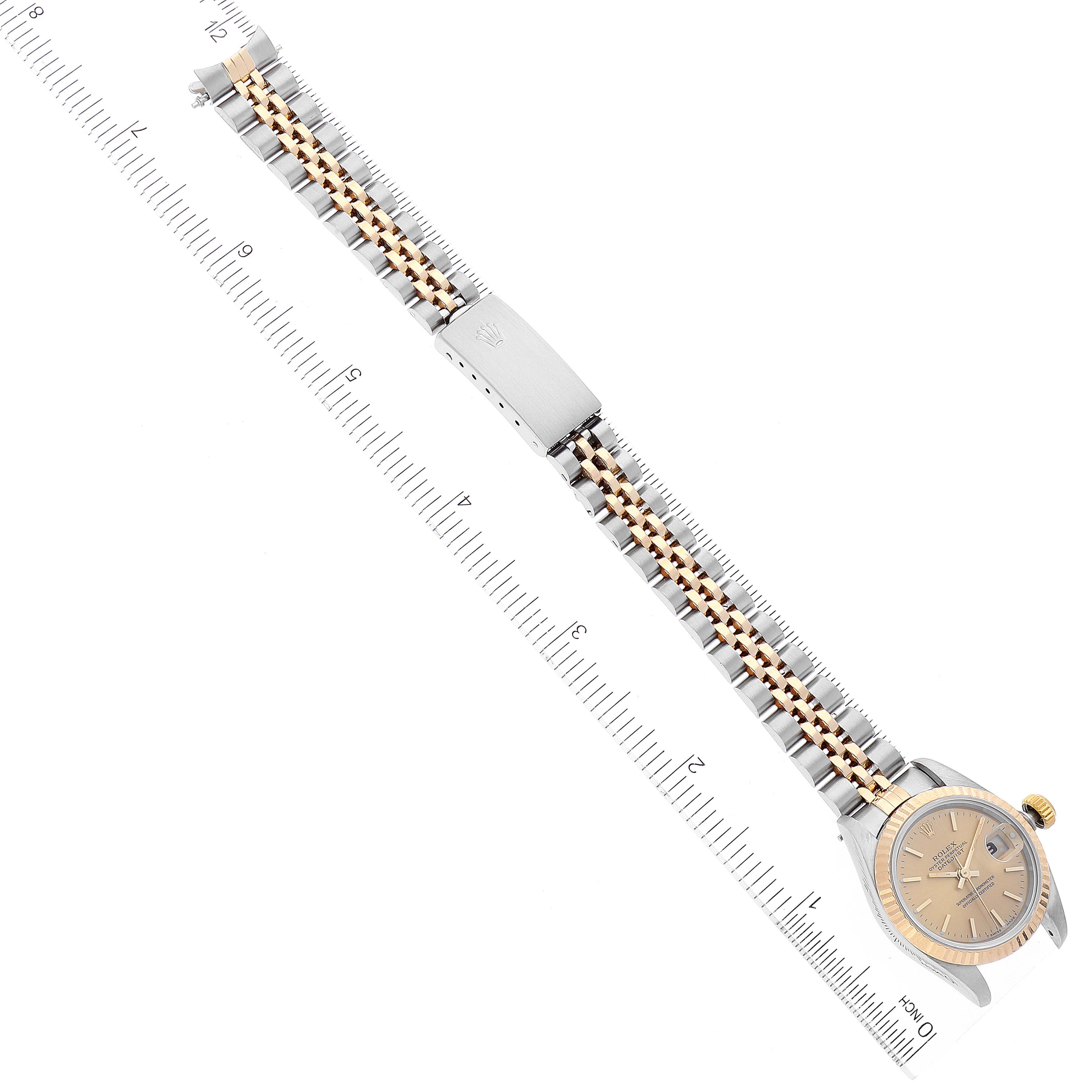 The image shows a top-down view of a Rolex Datejust 69173 Women's Steel and Gold (two tone) Champagne Dial 69173 Women's Steel and Gold (two tone) Champagne Dial watch including the face, bezel, crown, and full bracelet, measured against a ruler.