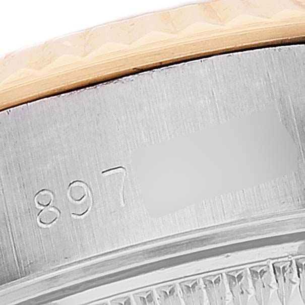 The image shows a close-up of the bezel and part of the serial number of a Rolex Datejust 69173 Women's Steel and Gold (two tone) Champagne Dial 69173 Women's Steel and Gold (two tone) Champagne Dial model.