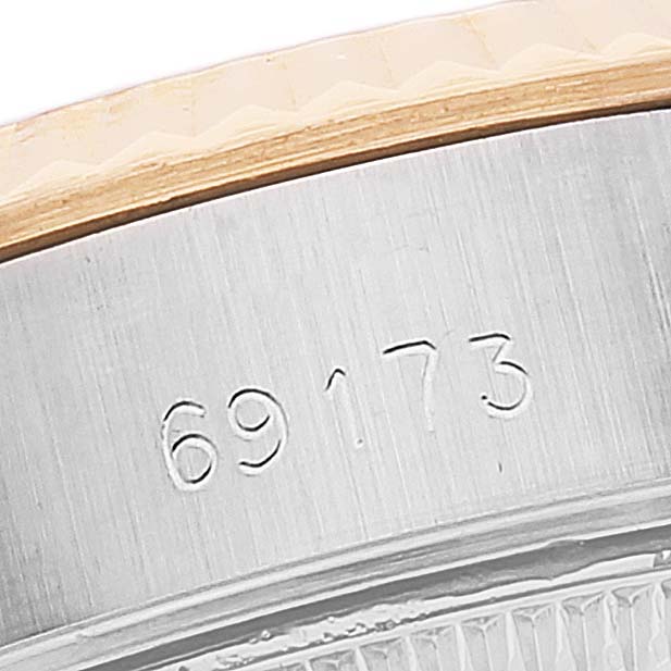 This close-up image of a Rolex Datejust 69173 Women's Steel and Gold (two tone) Champagne Dial 69173 Women's Steel and Gold (two tone) Champagne Dial watch shows the model number 69173 engraved on its casing.