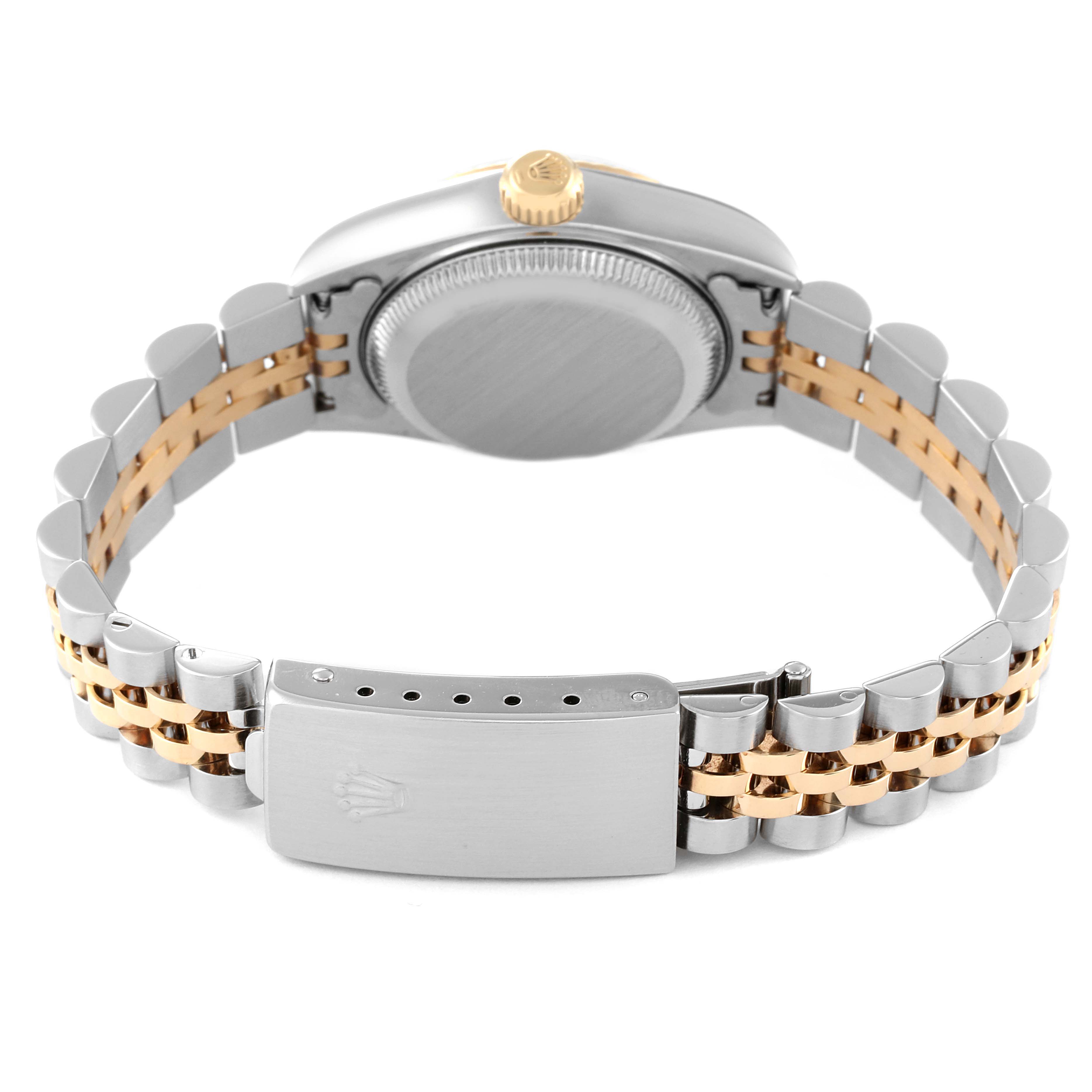 The image shows the back view of a Rolex Datejust 79163 Women's Steel and Gold (two tone) White Dial 79163 Women's Steel and Gold (two tone) White Dial watch, highlighting its case back, crown, and two-tone bracelet with clasp.